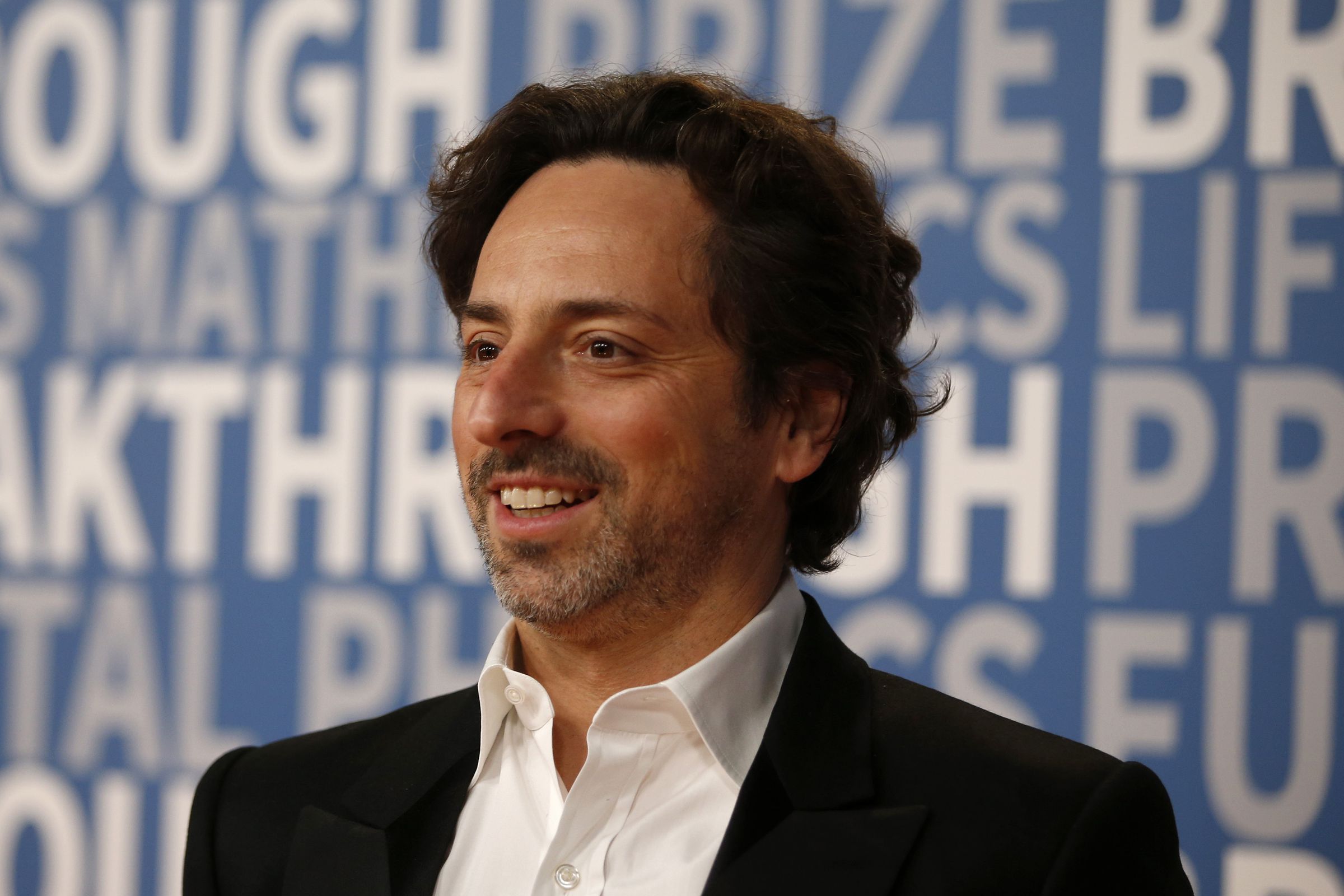 Sergey Brin poses for a picture on the red carpet for the 6th annual 2018 Breakthrough Prizes at Moffett Federal Airfield, Hangar One in Mountain View, Calif., 