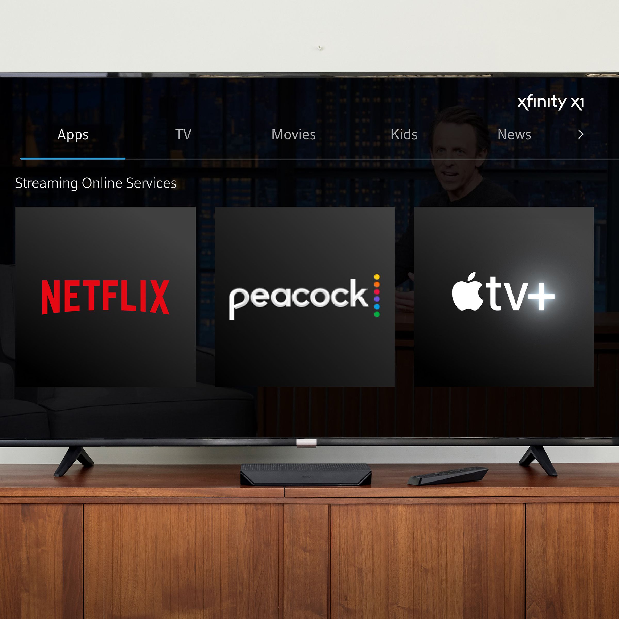 A photo showing Comcast, Peacock, and Apple TV Plus icons on a TV screen