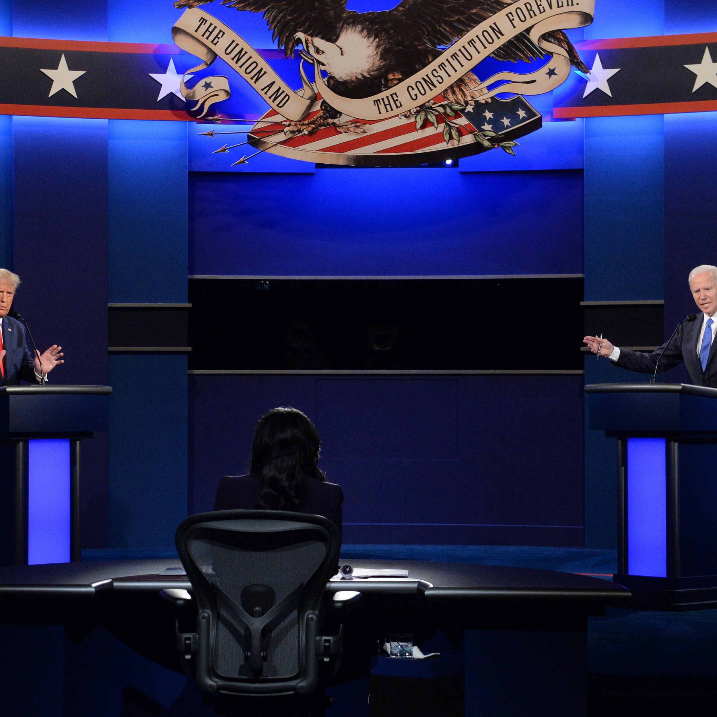 Former President Donald Trump (left) and President Joe Biden (right) stand at podiums during their last 2020 debate.