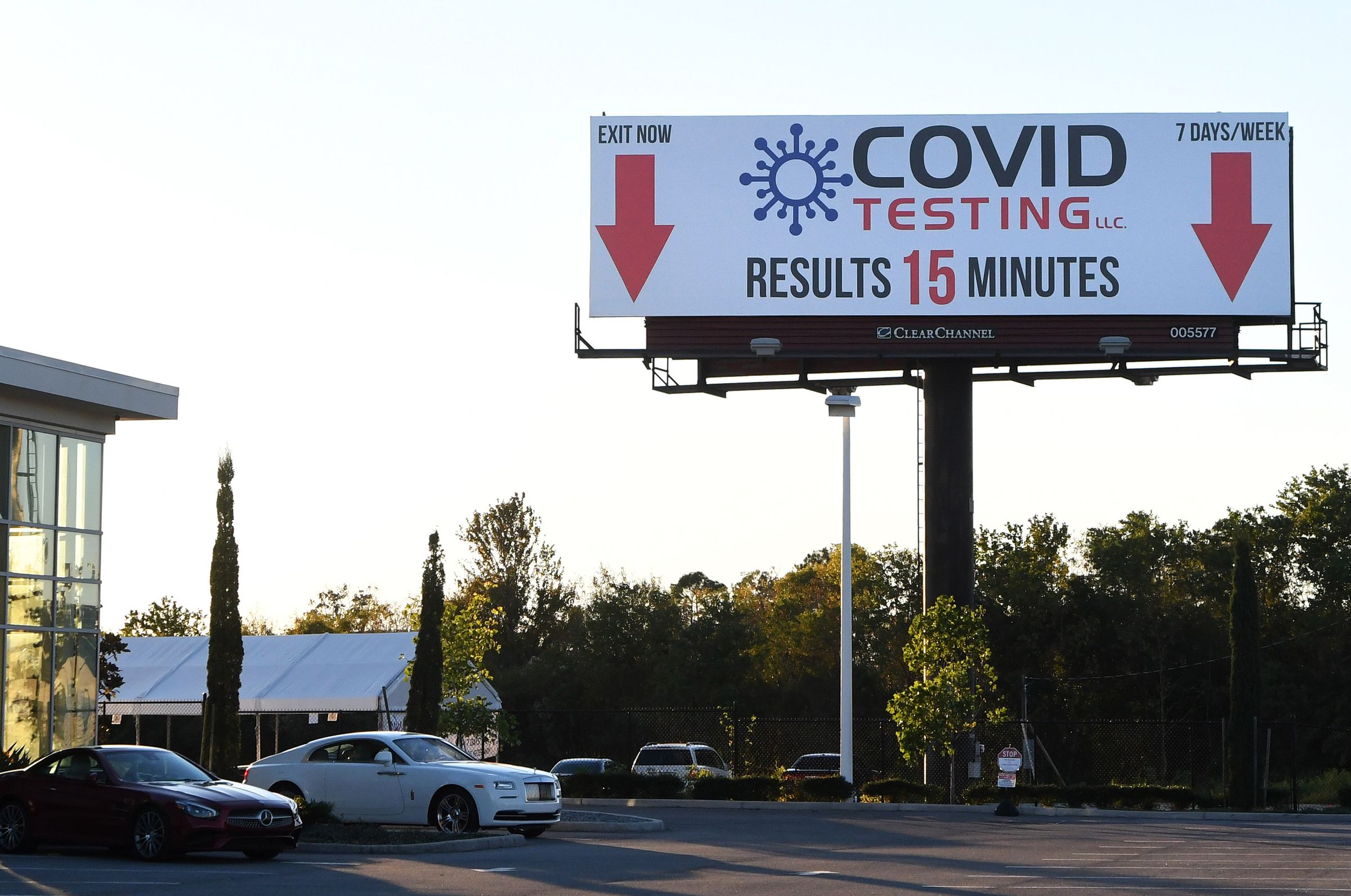 A billboard advertises a rapid COVID-19 test site. Florida...