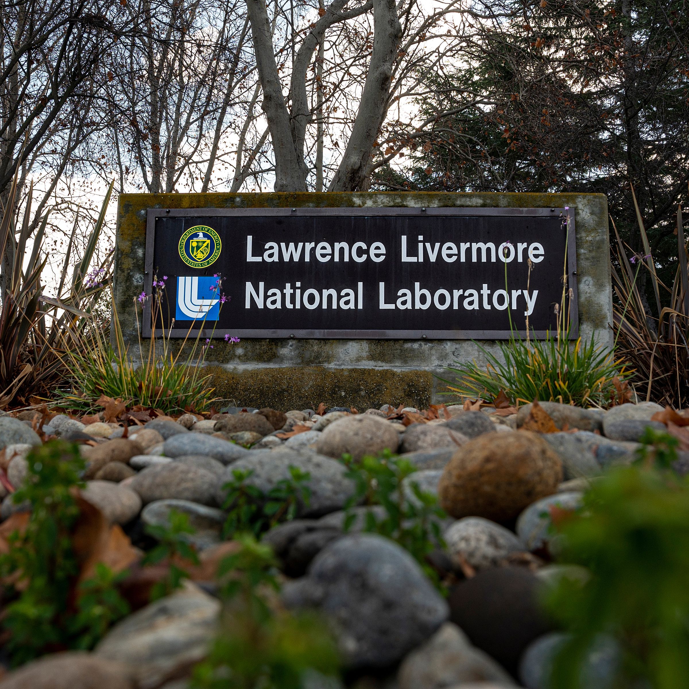 A sign at a gate entrance to the Lawrence Livermore National Laboratory