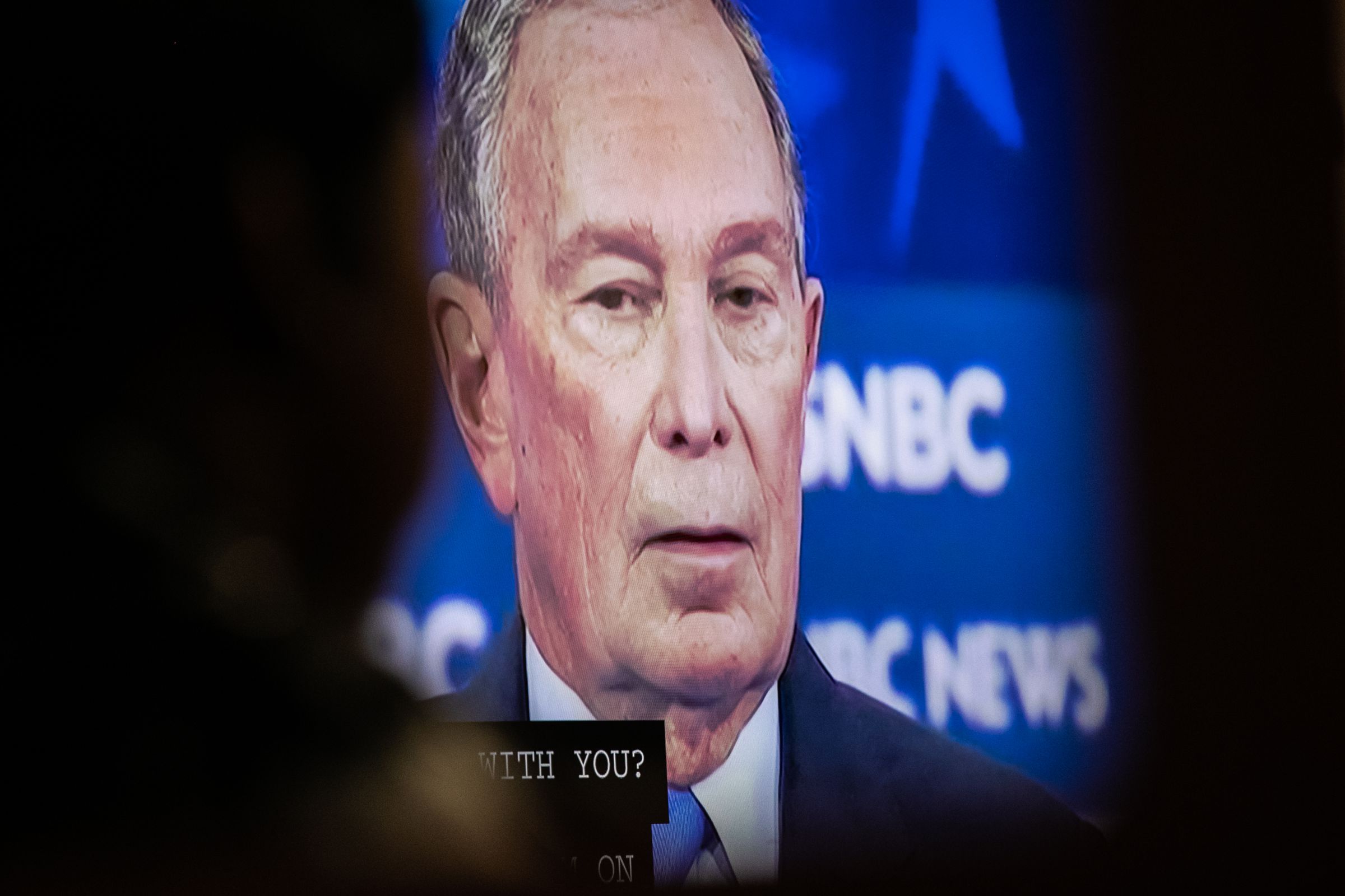 Democratic presidential candidate former New York City Mayor Mike Bloomberg is shown on a screen during a debate watch party at the candidate’s field office on Wednesday in the Brooklyn borough of New York City