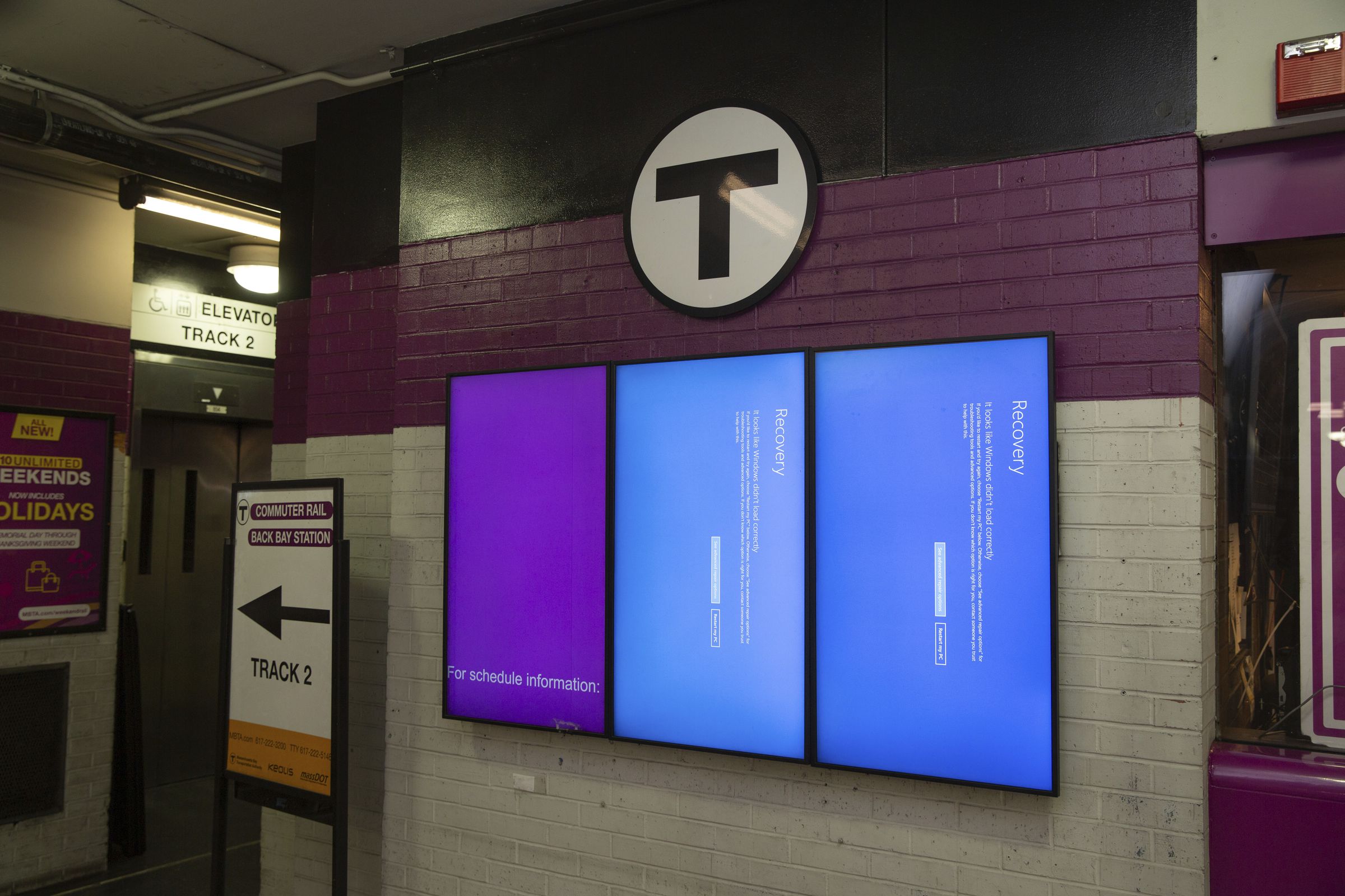 Computer screens show an error at an Amtrak waiting area at Back Bay station in Boston, MA.