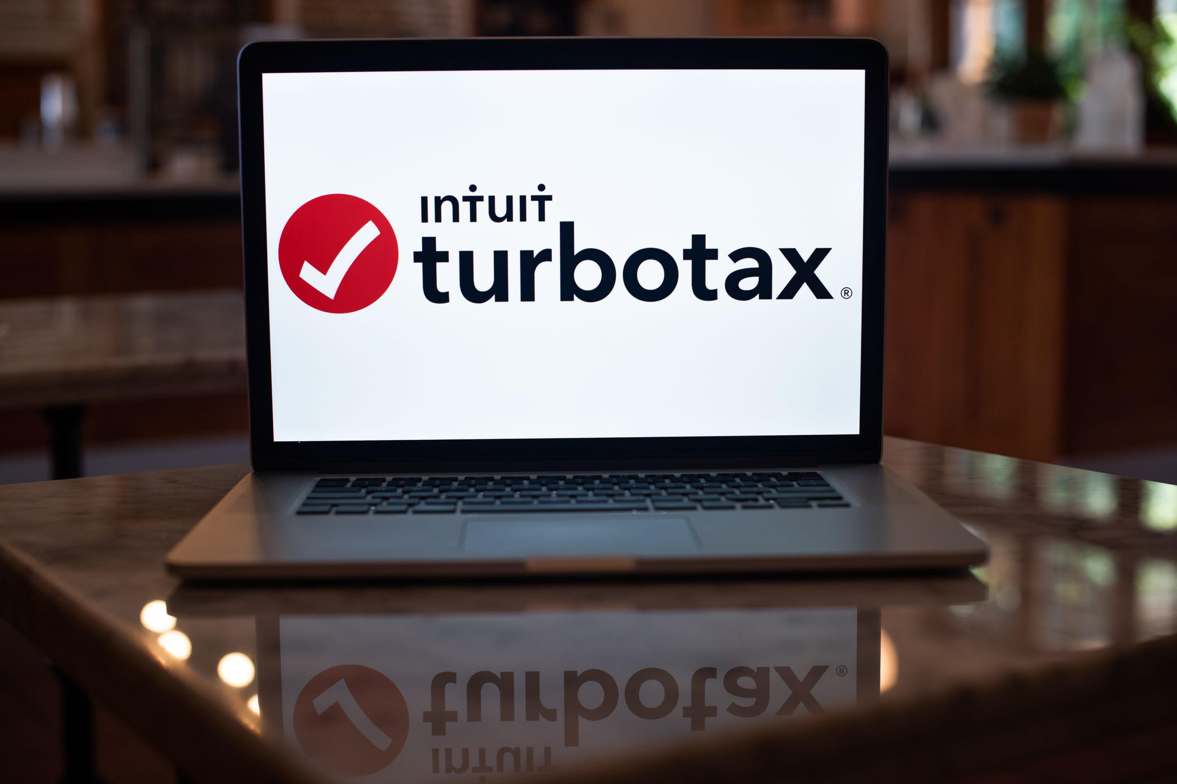 A photo showing the TurboTax logo on a laptop