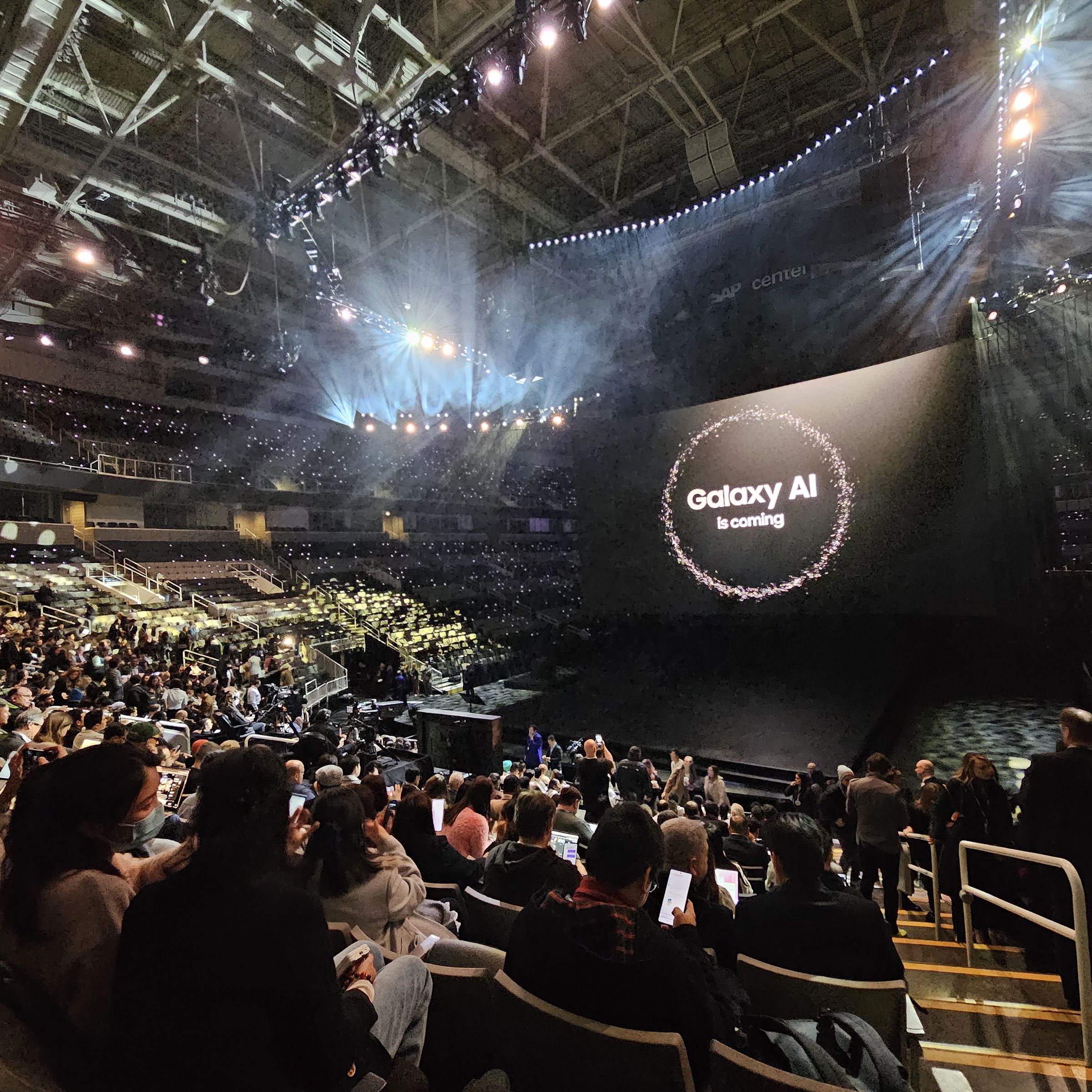 Image of arena with Unpacked presentation on screen.