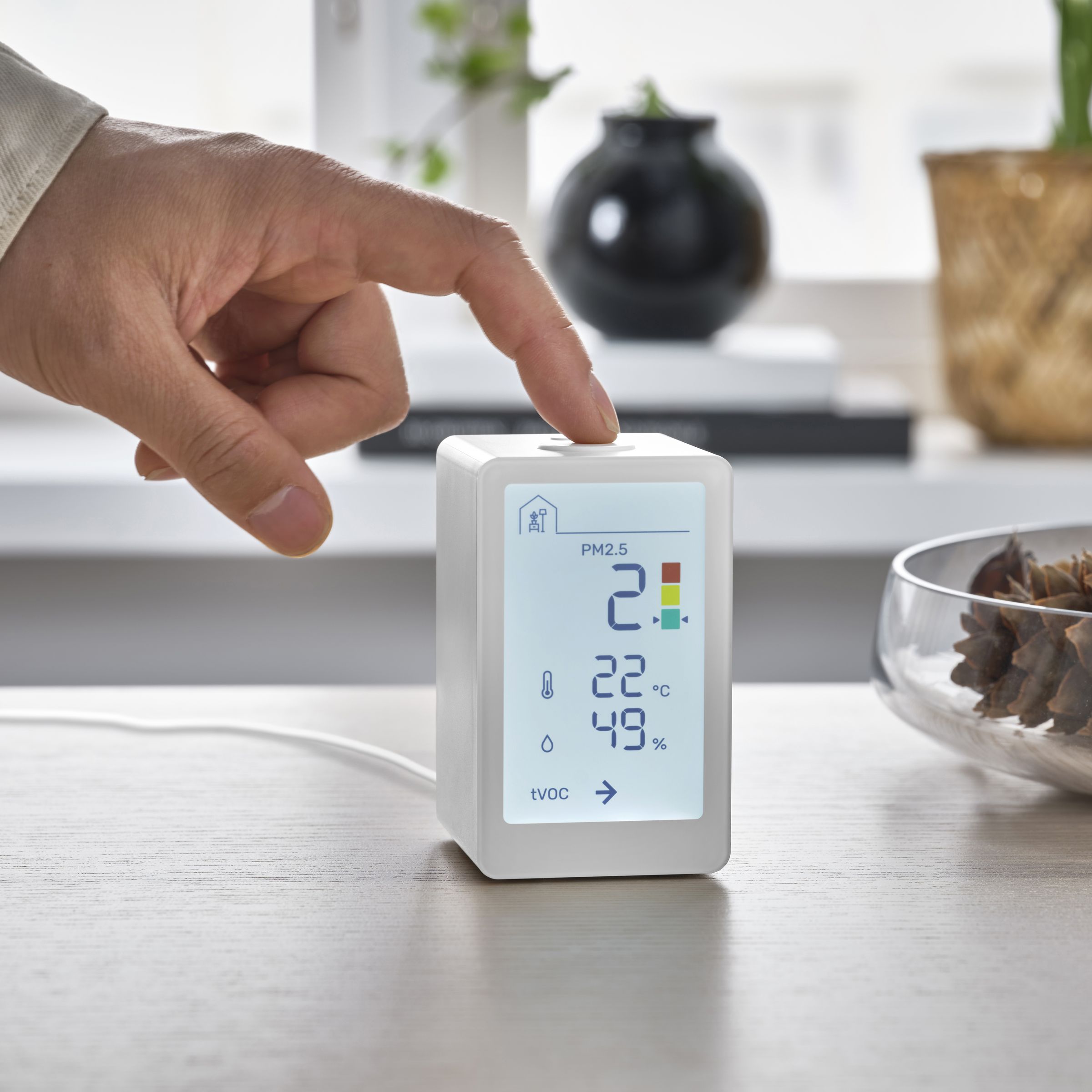 The Vindstyrka indoor air quality monitor has a large screen for seeing current temperature, humidity, and particulate matter levels.