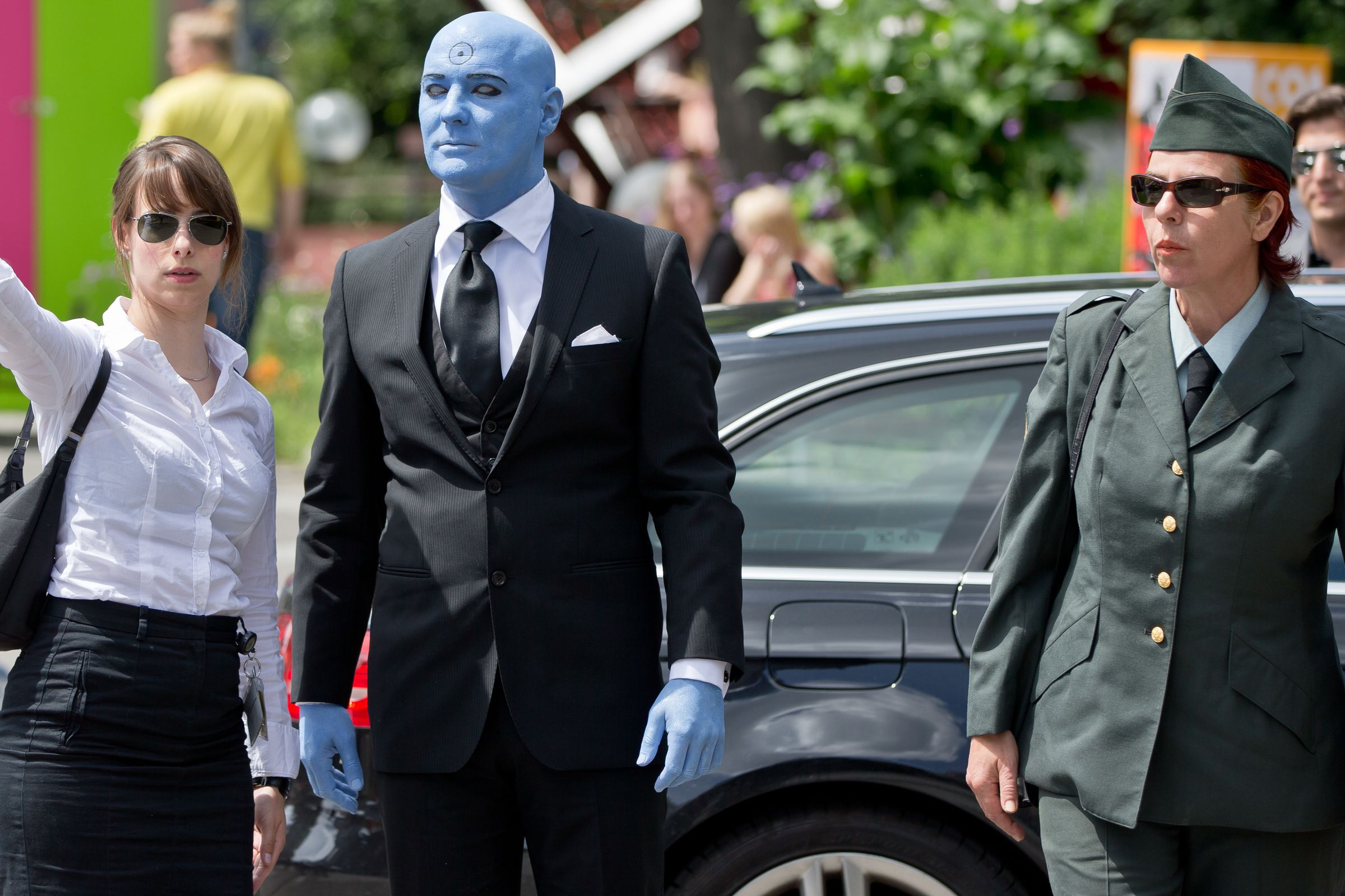 A man costumed as ‘Dr. Manhattan’ of the comic ‘Watchmen’ arrives at the International Comic Salon, accompanied by ‘military escort’ in Erlangen, Germany, 19 June 2014.&nbsp;