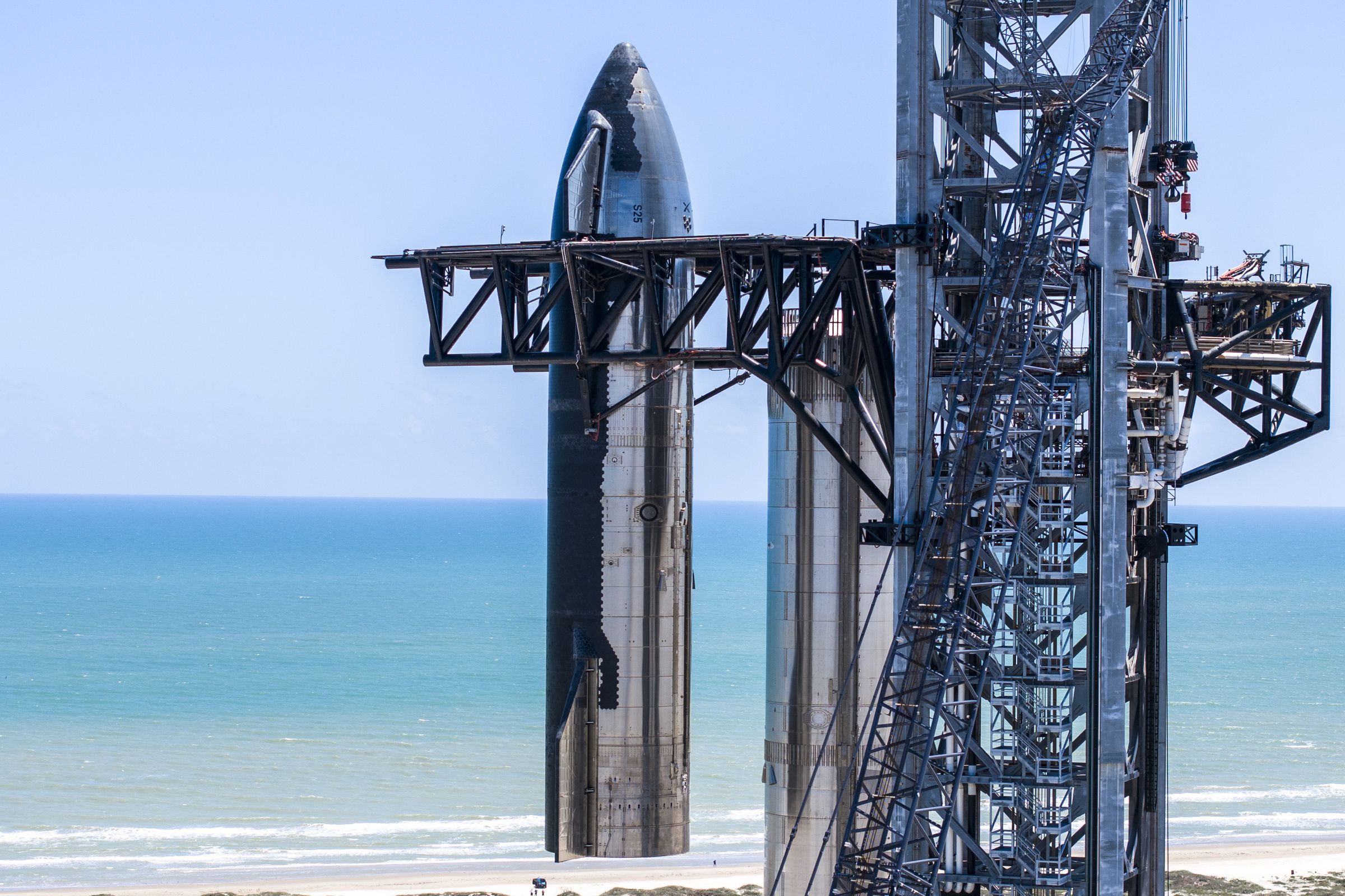 SpaceX Starship protoype shown mounted on a launch tower without the Super Heavy booster rocket attached