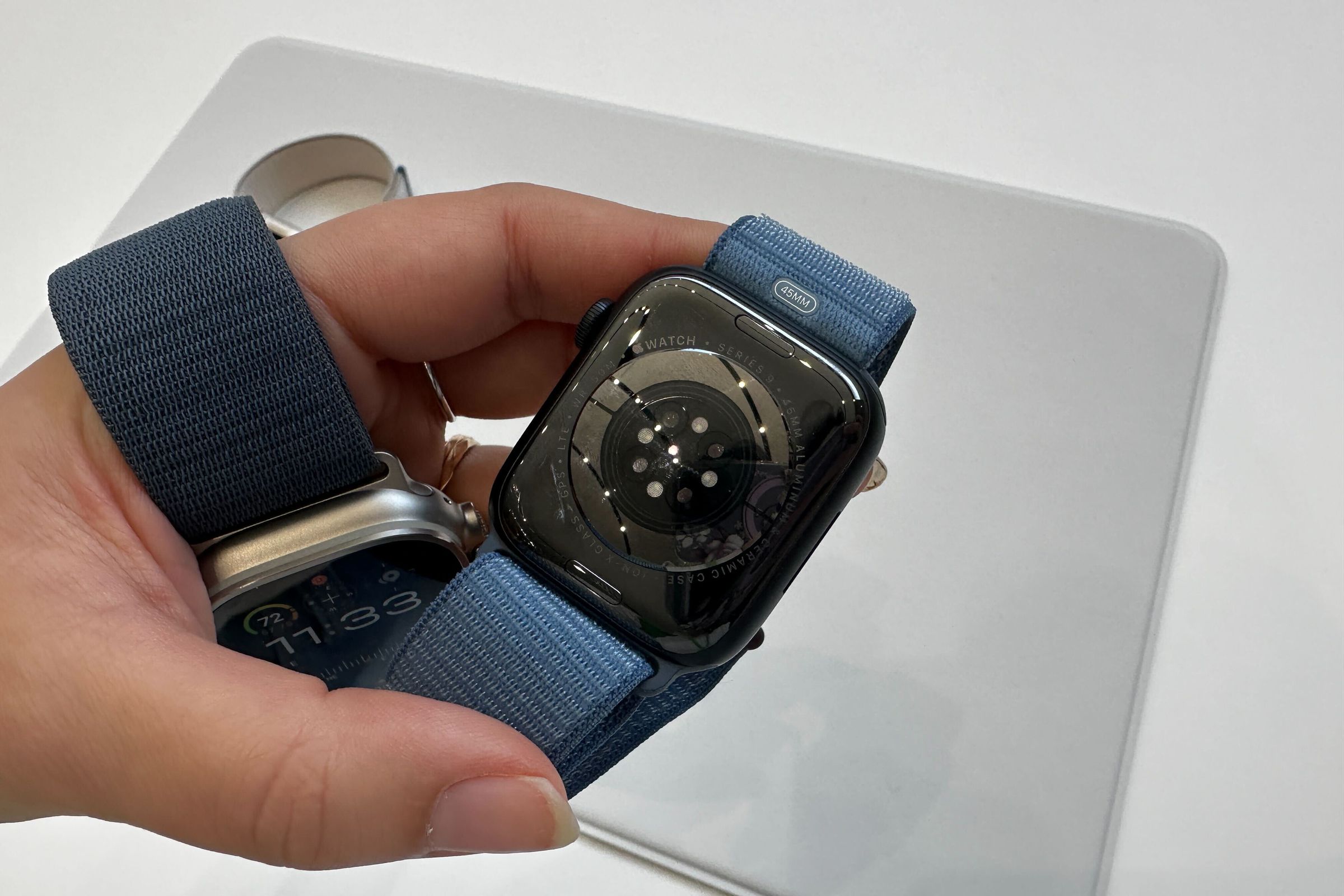 An Apple Watch Ultra 2 and the bottom of an Apple Watch Series 9.