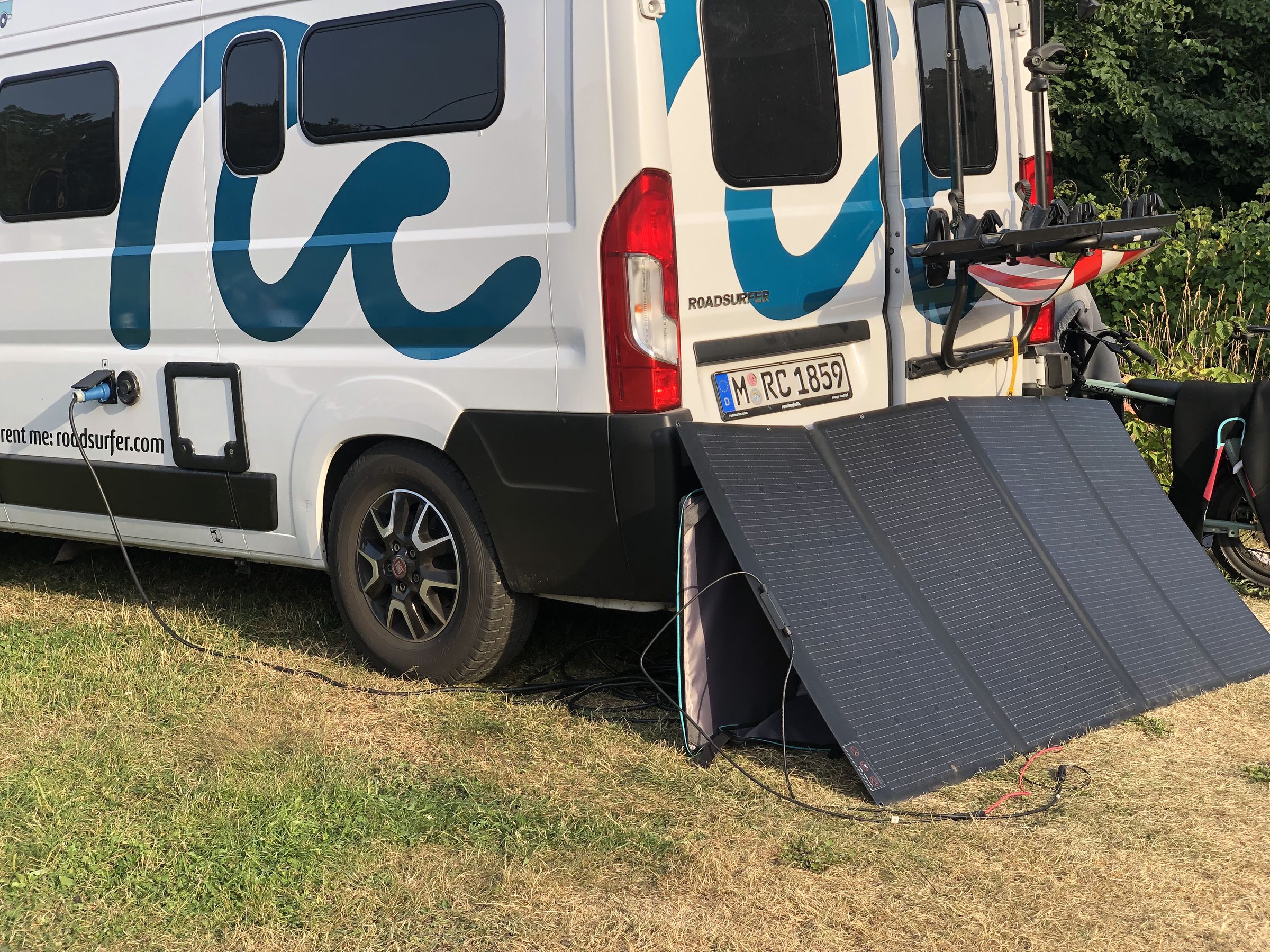 A 400W EcoFlow solar panel charges the Delta Pro (inside the van), which charges the Fiat Ducato RV.