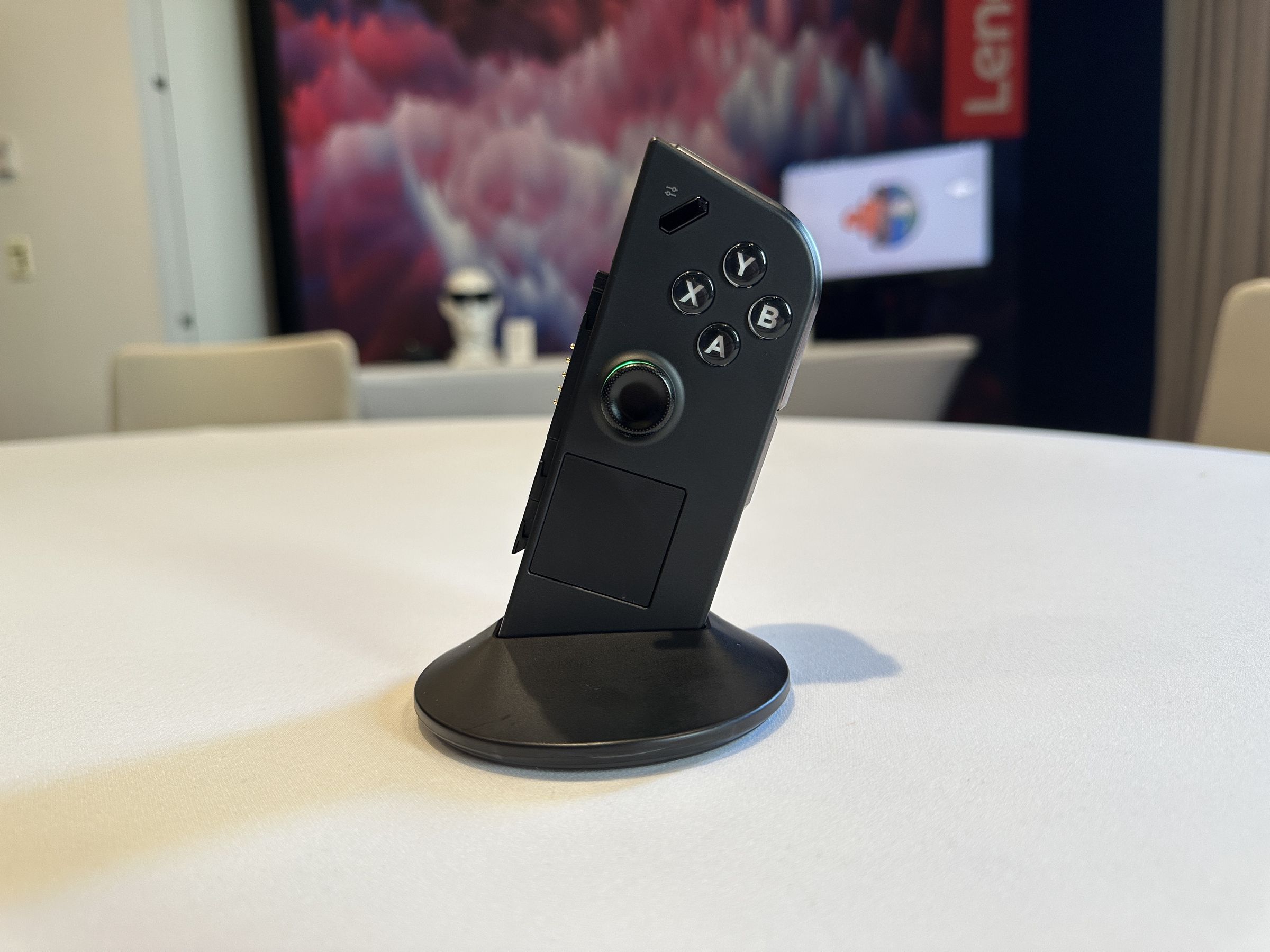 The Lenovo Legion Go controller propped up with a plastic stand.