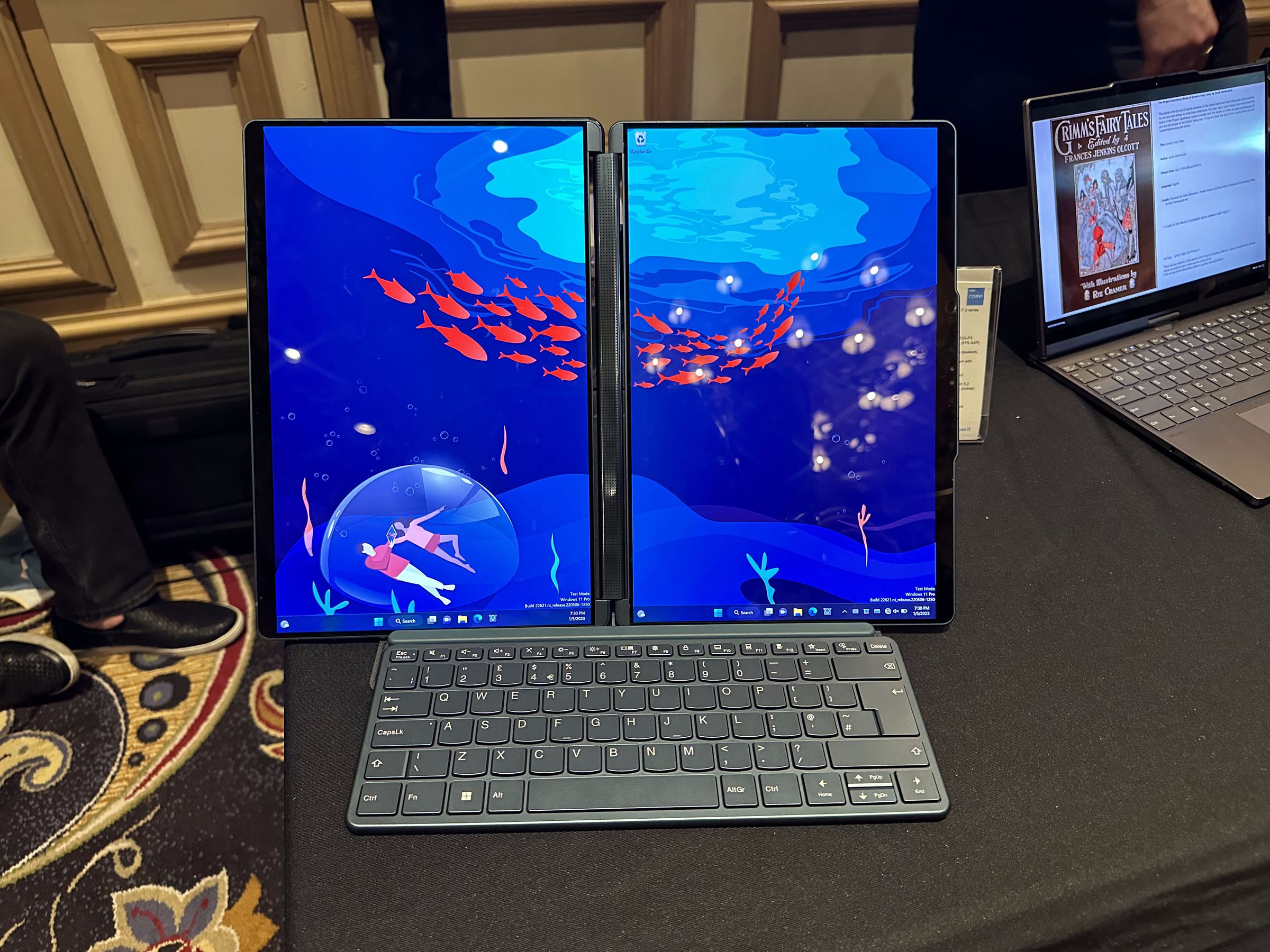 The Lenovo Yoga Book 9i in horizontal mode with the keyboard attached.