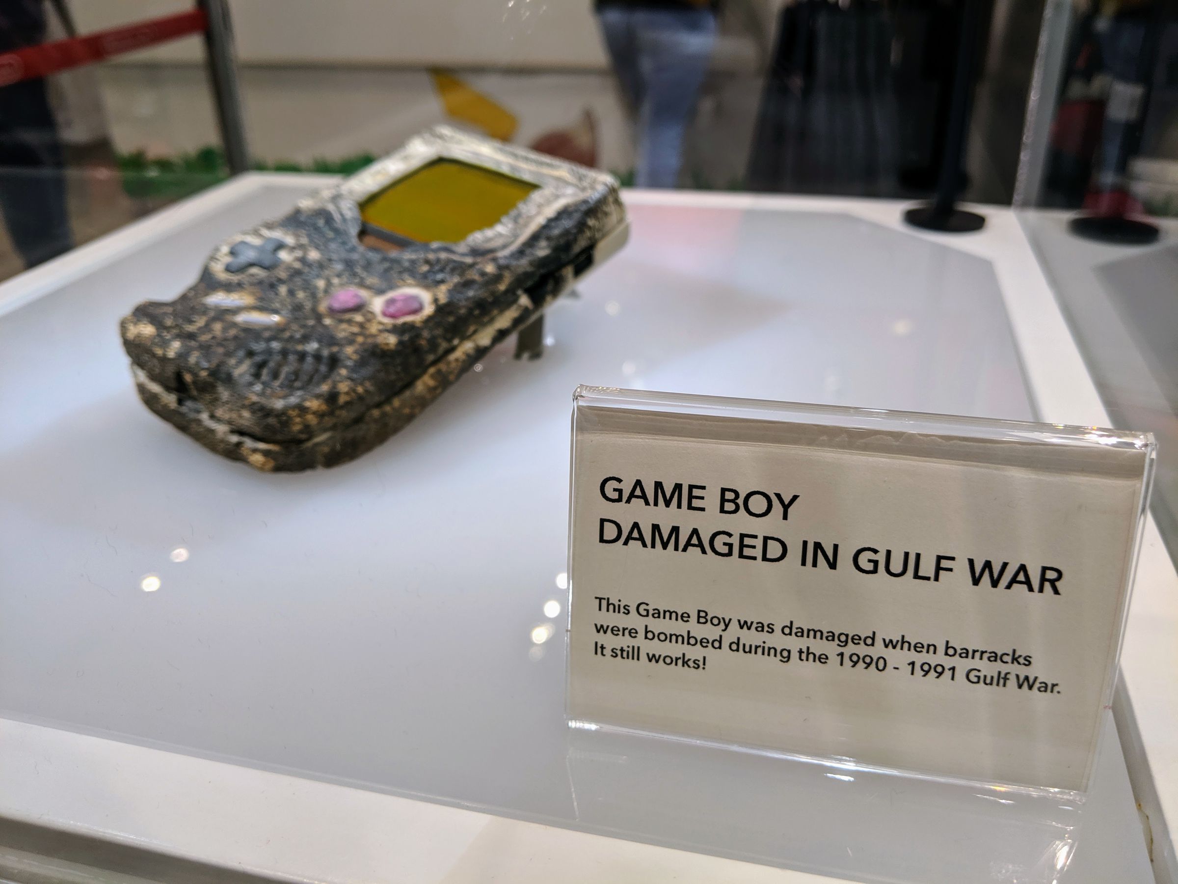 Nintendo’s original plaque reads “Game Boy Damaged in Gulf War. This Game Boy was damaged when barracks were bombed during the 1990 - 1991 Gulf War. It still works!”
