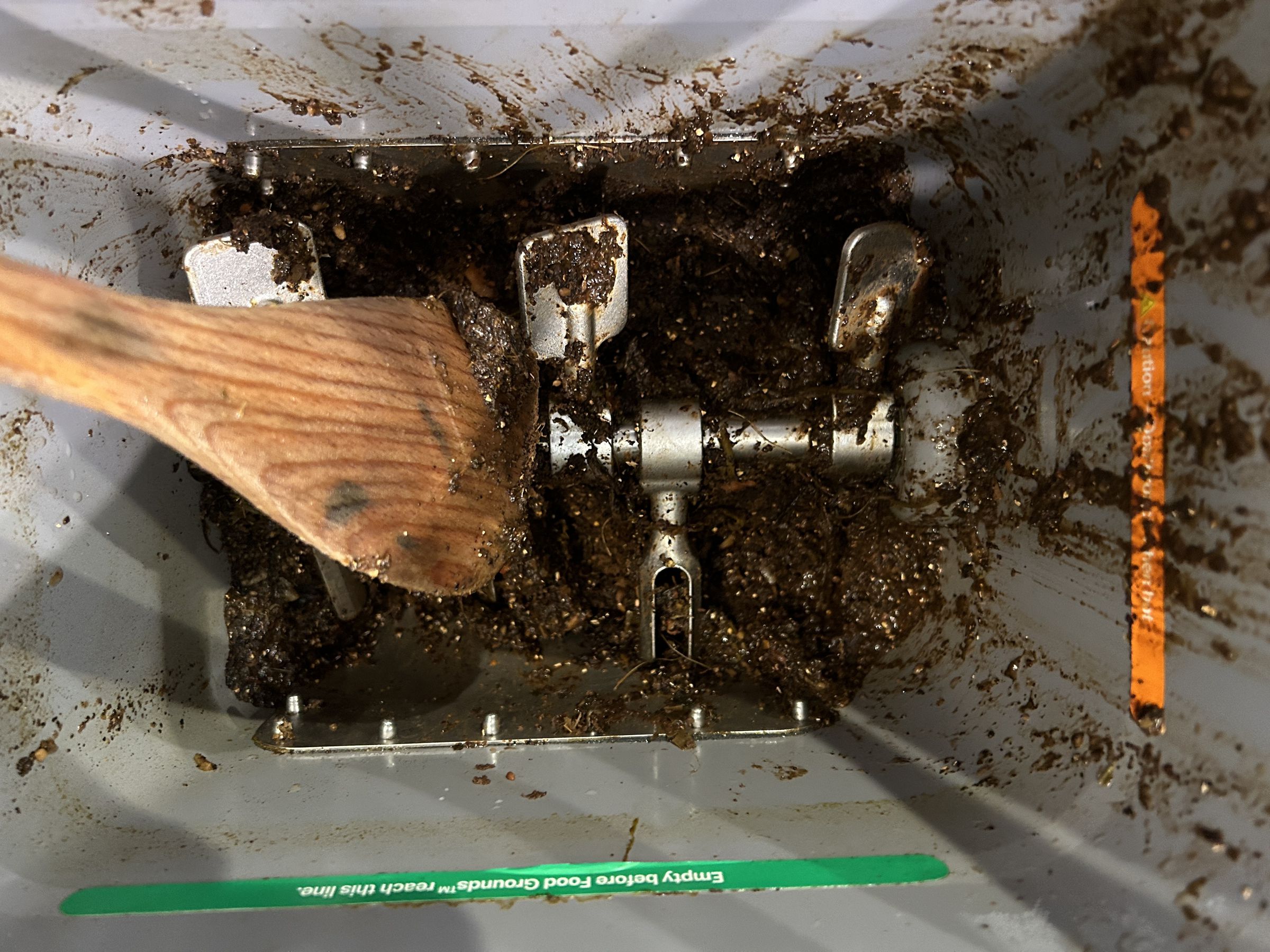 The food grounds generally resemble dirt, but when the bin got jammed, Mill told me to soak them to try and clear it out. The resulting sludge was so immovable I had to send the bucket back to Mill to deal with.