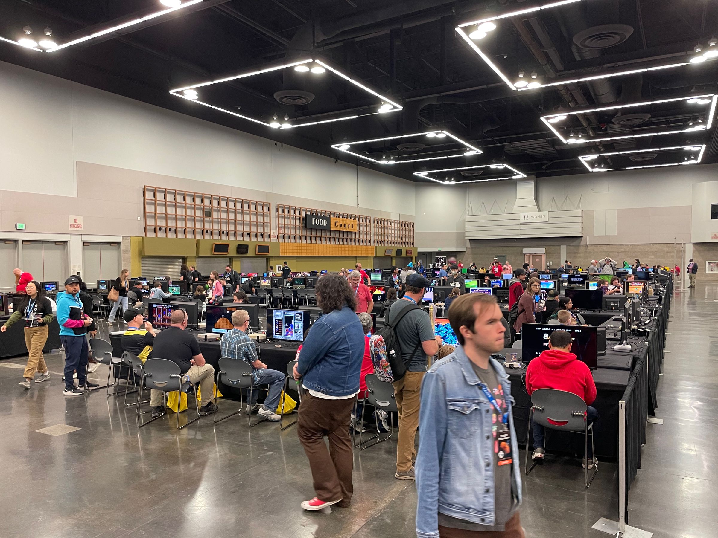 People playing games at the Portland Retro Gaming Expo 2023.