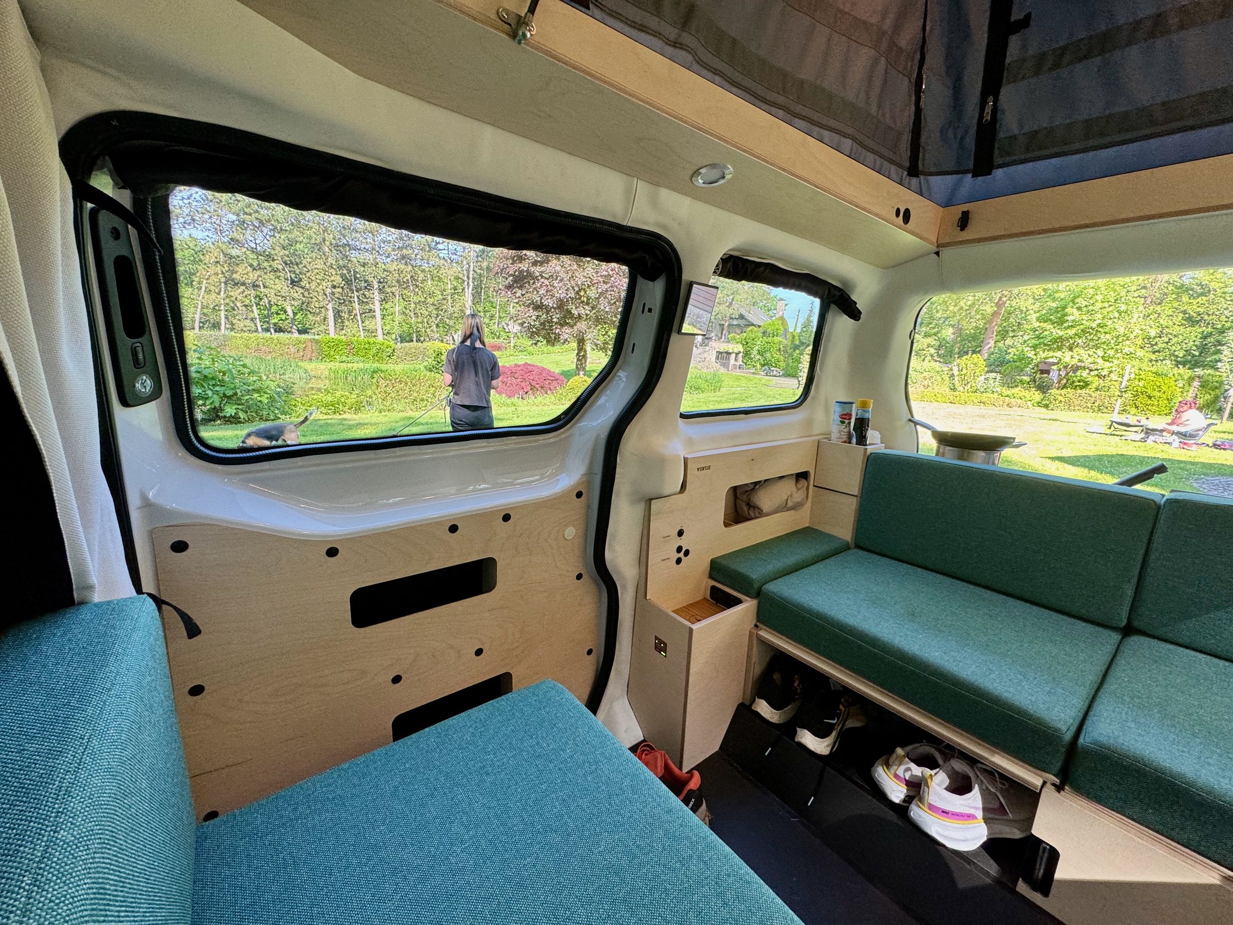 <em>View of the passenger side. Note the large storage pockets in the sliding door. There’s lots more under the removable cushions.</em>