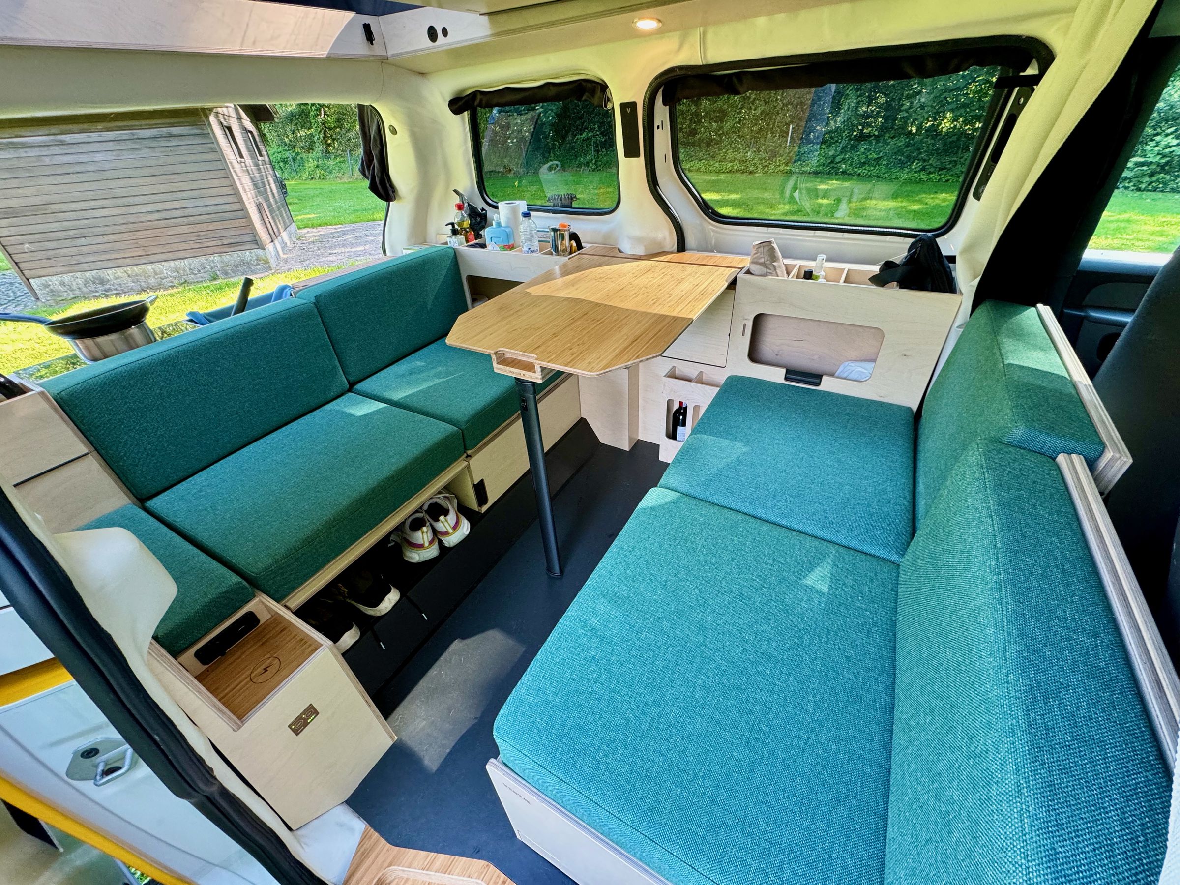 <em>Lounge mode with the table up and ready for use. This also exposes a wine cabinet and lockable safe.</em>