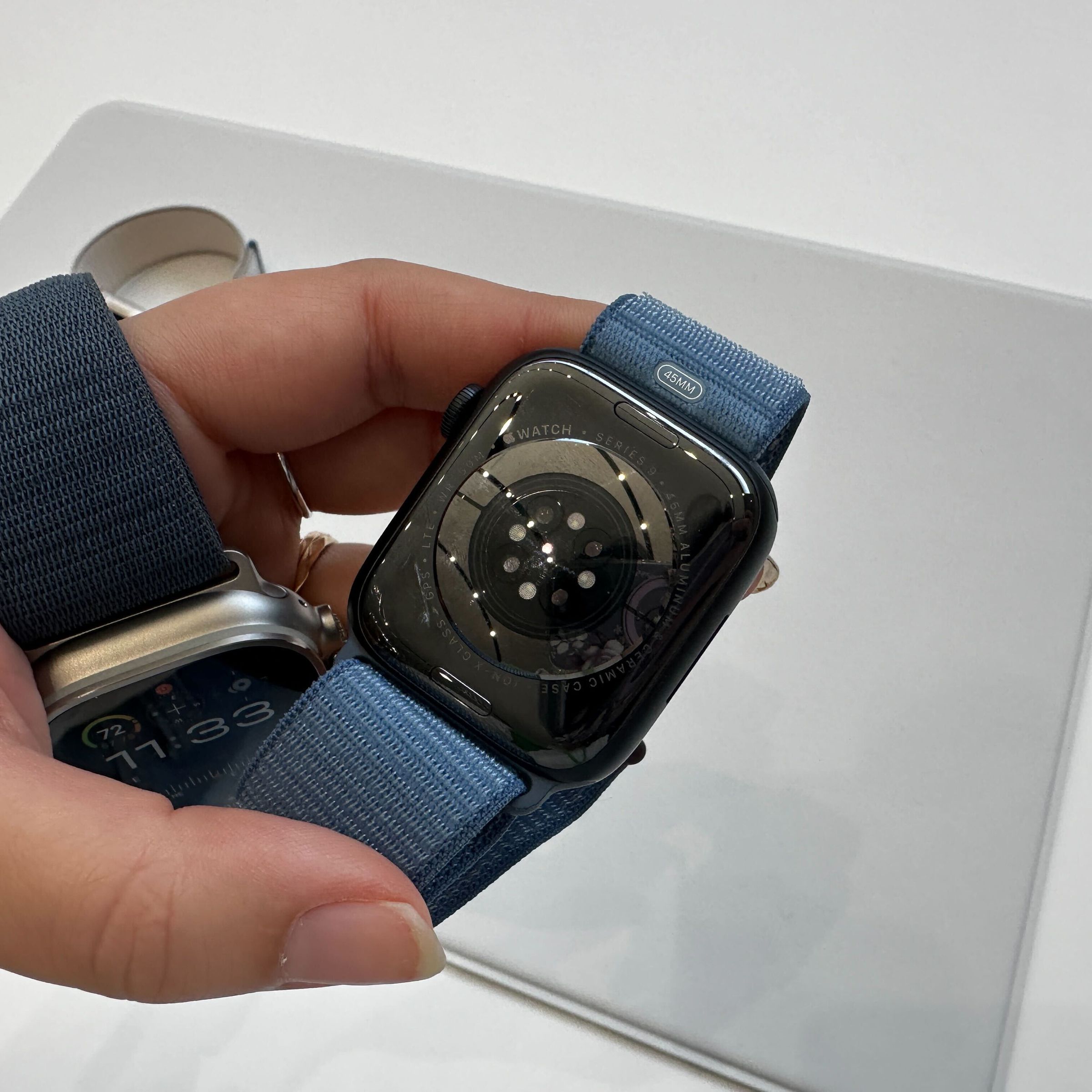 An Apple Watch Ultra 2 and the bottom of an Apple Watch Series 9.