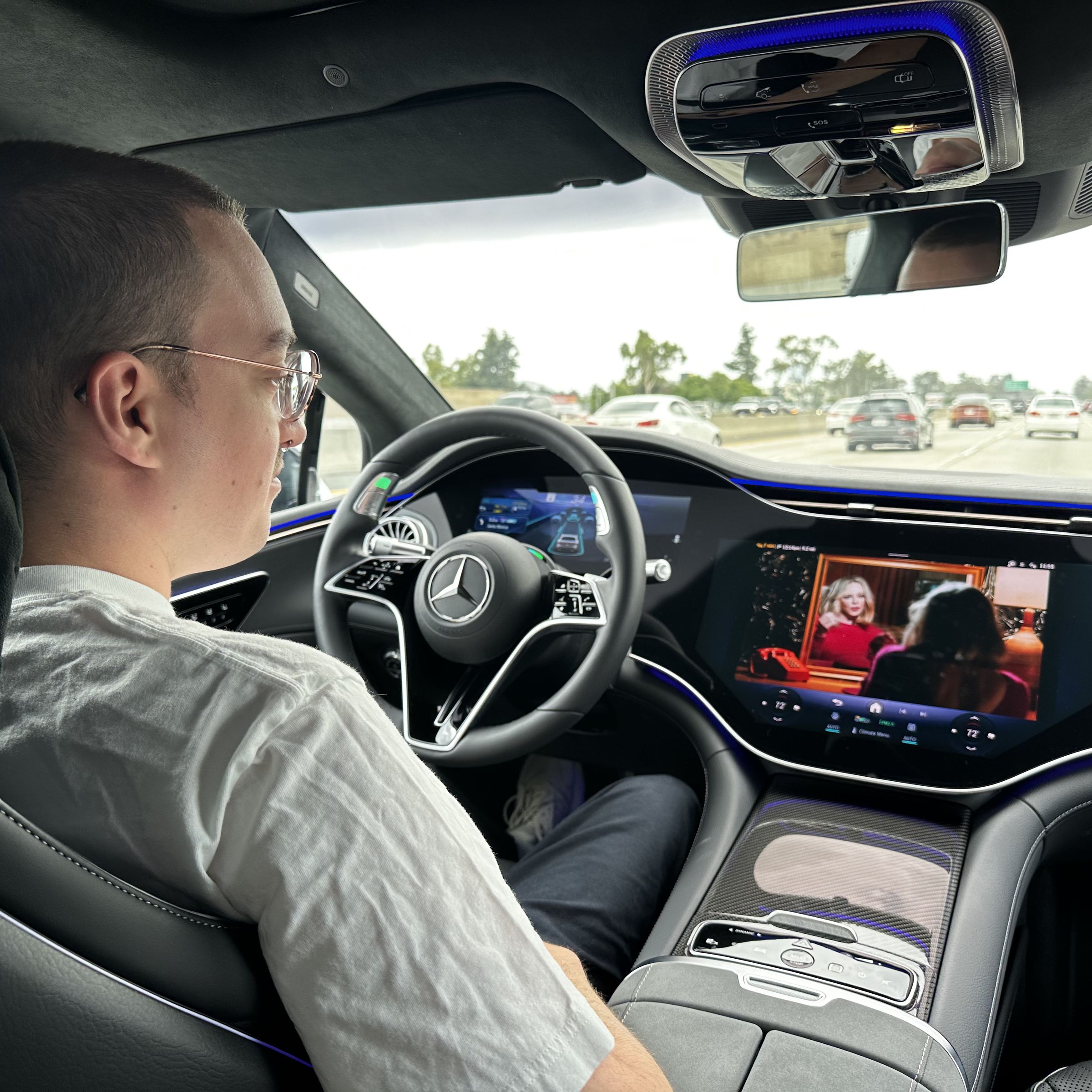 A driver using Mercedes-Benz’s Level 3 Drive Pilot system