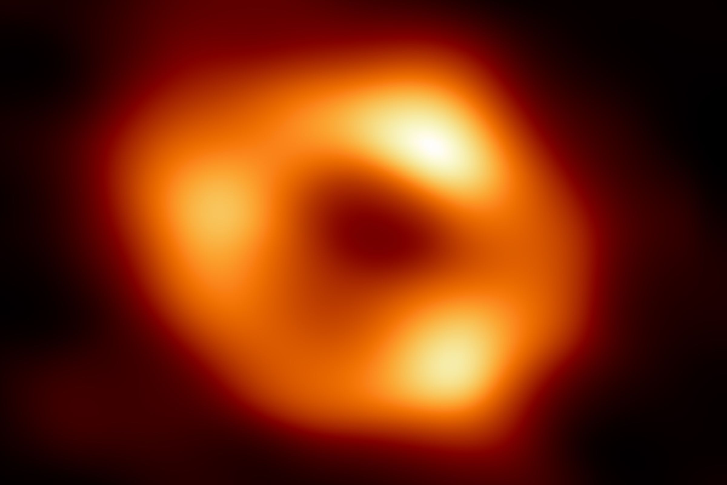 A bright orange ‘donut’ against a dark background