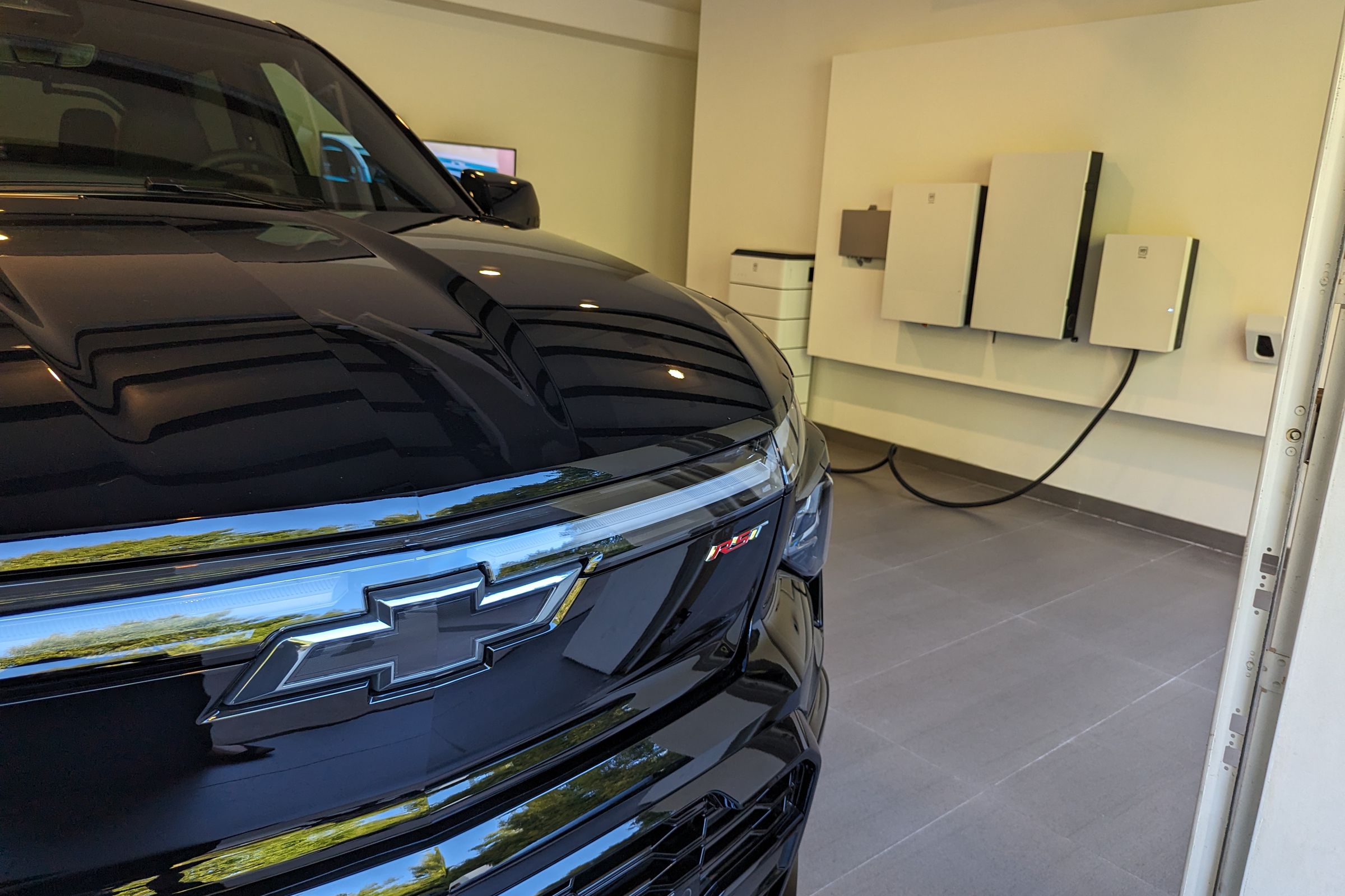 Chevy Silverado EV plugged into GM Energy batteries