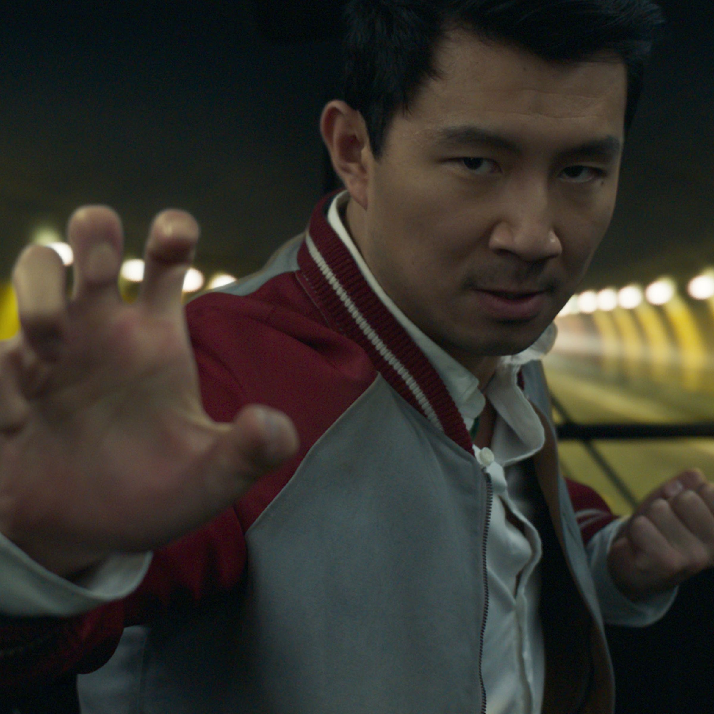 Actor Simu Liu in a fighting pose.