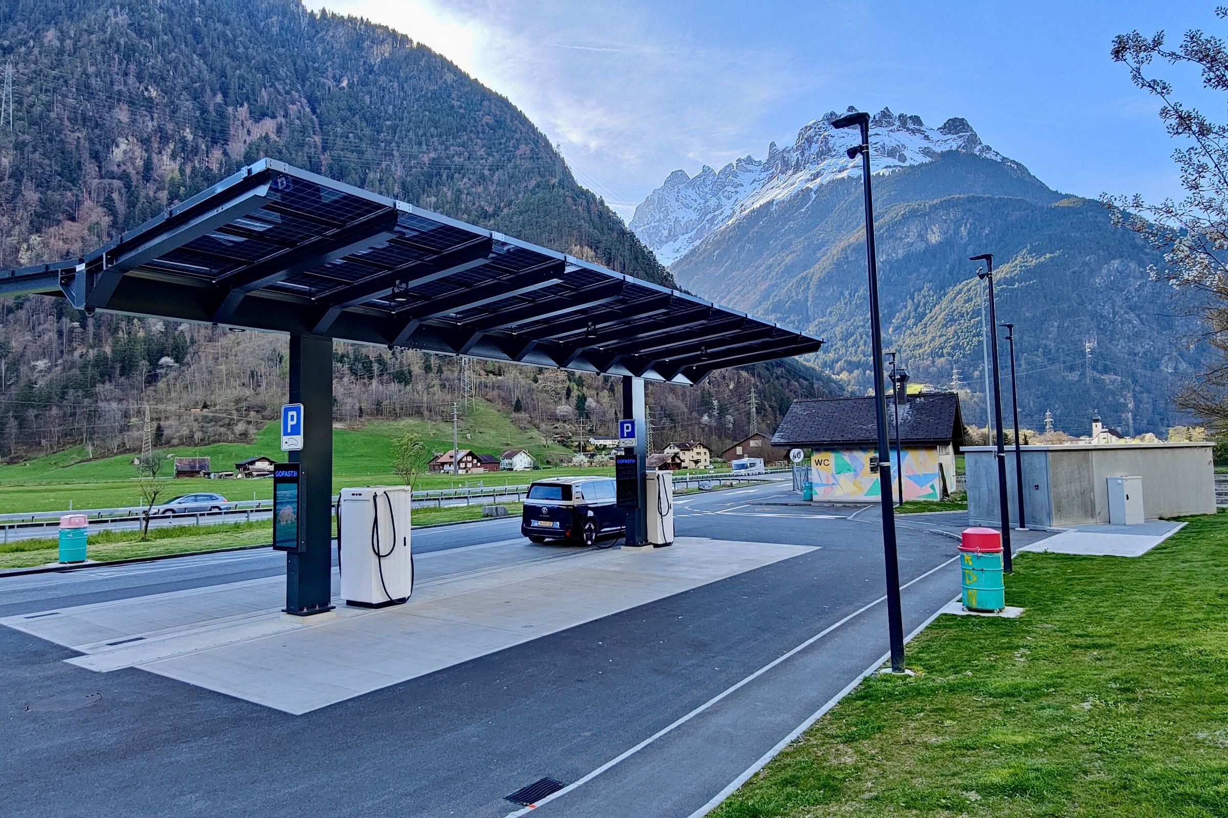 A typical scene at ultra-fast charging stations in Europe: everything working and lots of availability. This one had a long protected walking path for the dog along the right-hand side bordering a creek.
