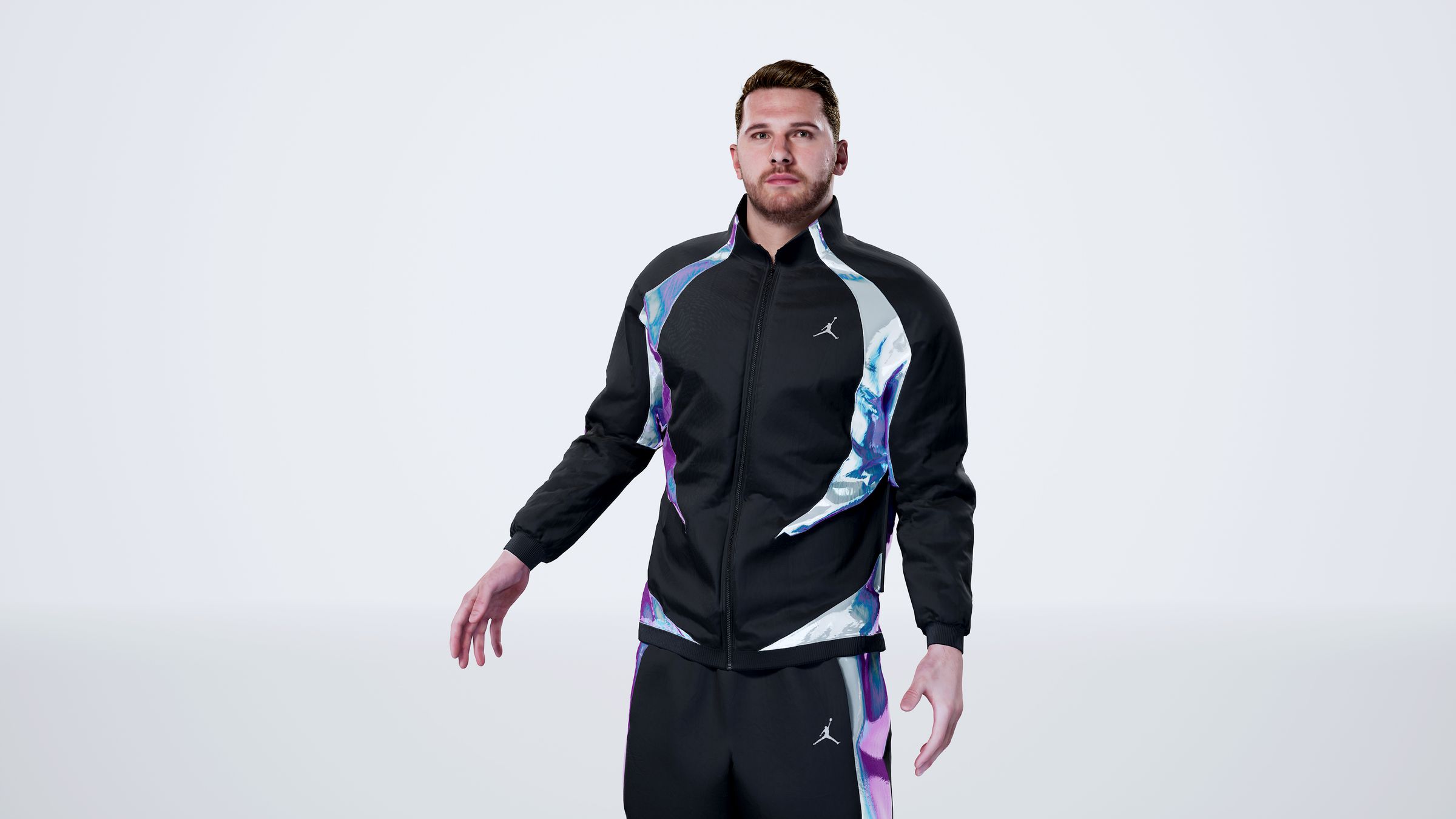 Another digital recreation of Luka Dončić stands in a white room, this one a little closer to the camera.