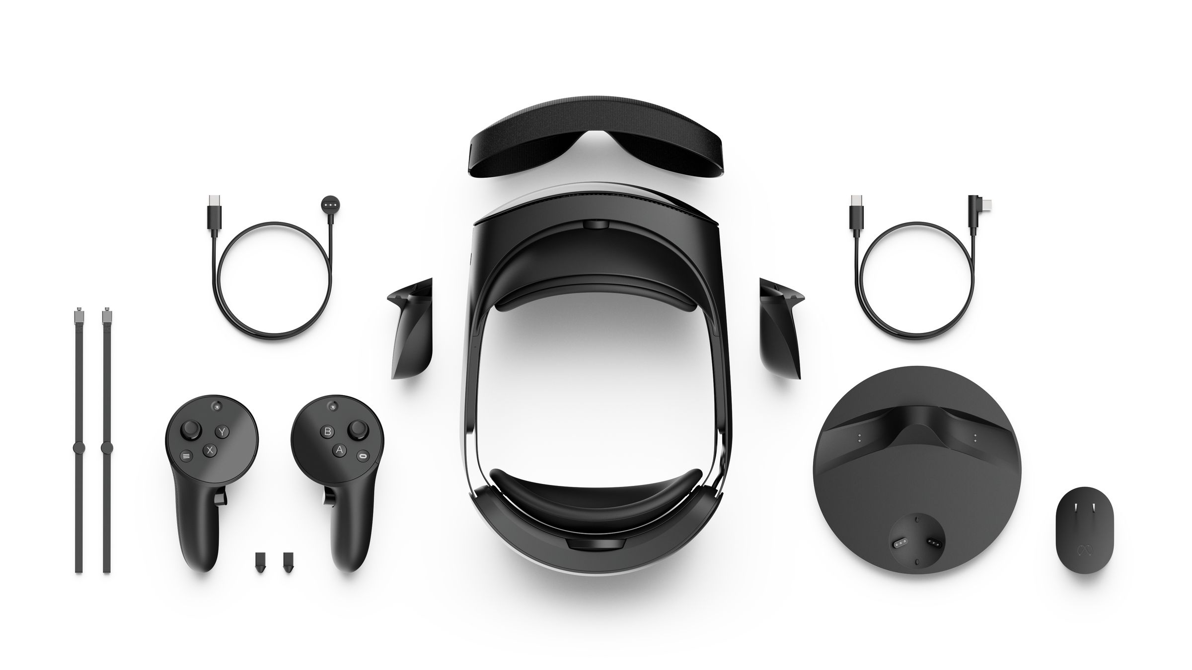 A picture of the Quest Pro’s accessories, including controllers, a charging dock, and optional face masks