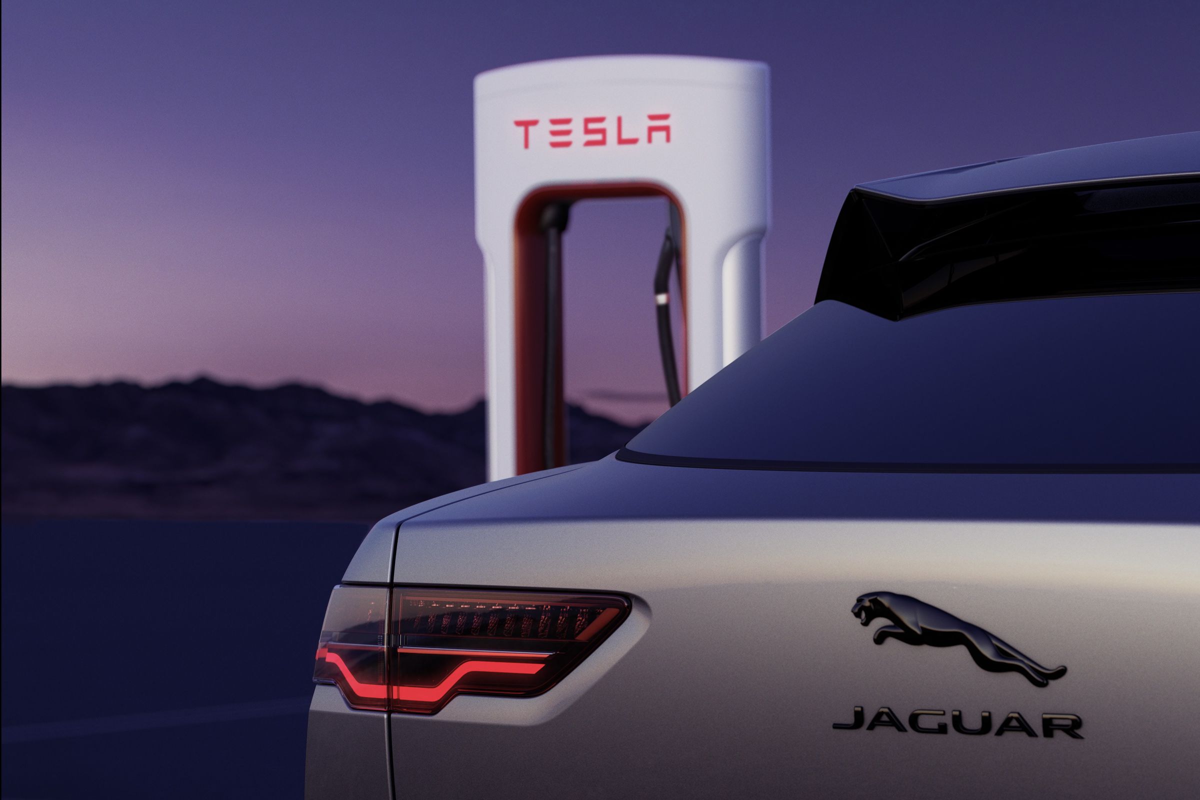 a jaguar vehicle parked in front of a tesla supercharger stall