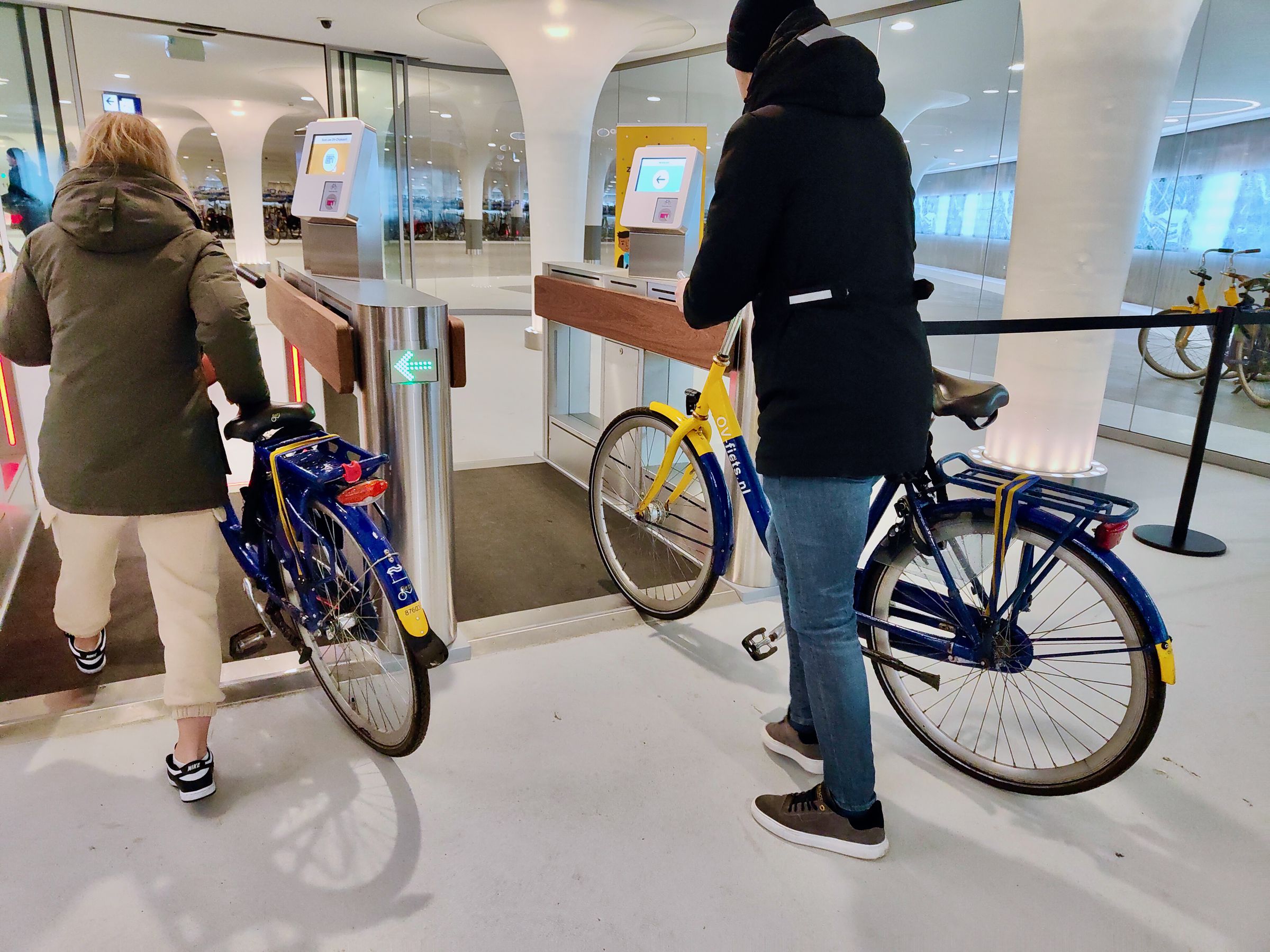 <em>Two bike-share bicycles being checked in.</em>
