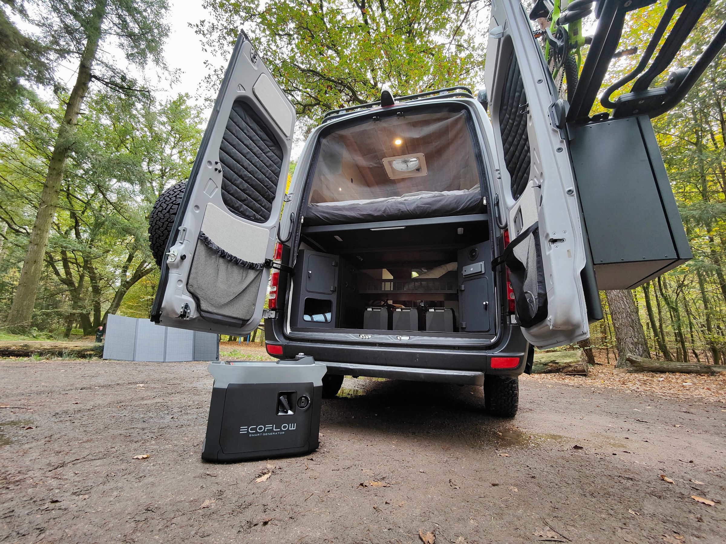 Here’s a custom RV I reviewed from Origin Travelvans with a massive EcoFlow Power Kit (inside), an EcoFlow 400W folding solar panel (and more on the roof), and EcoFlow Smart Generator (on the ground) for unlimited off-grid adventuring.