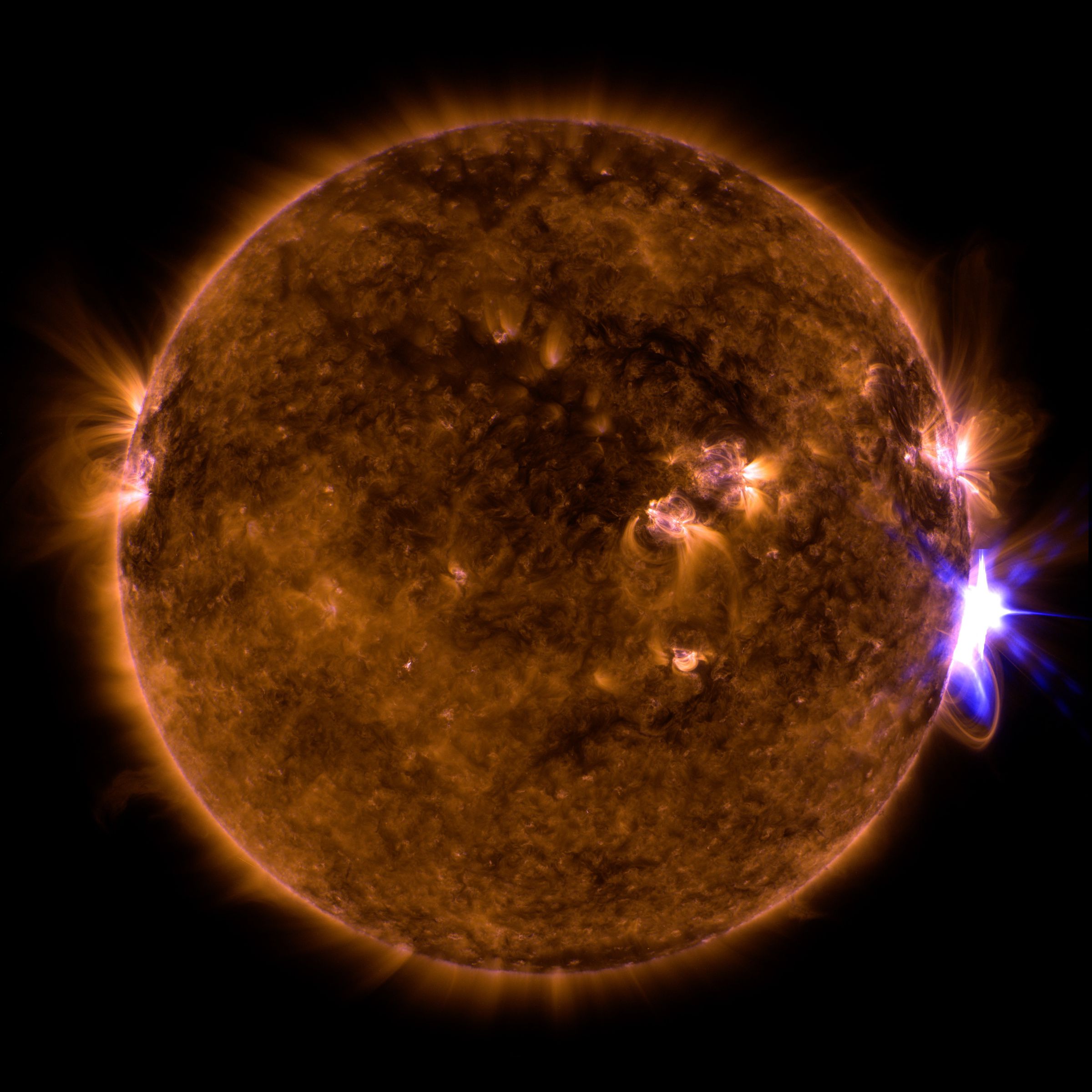 The Sun erupting a solar flare, which are related to coronal mass ejections.