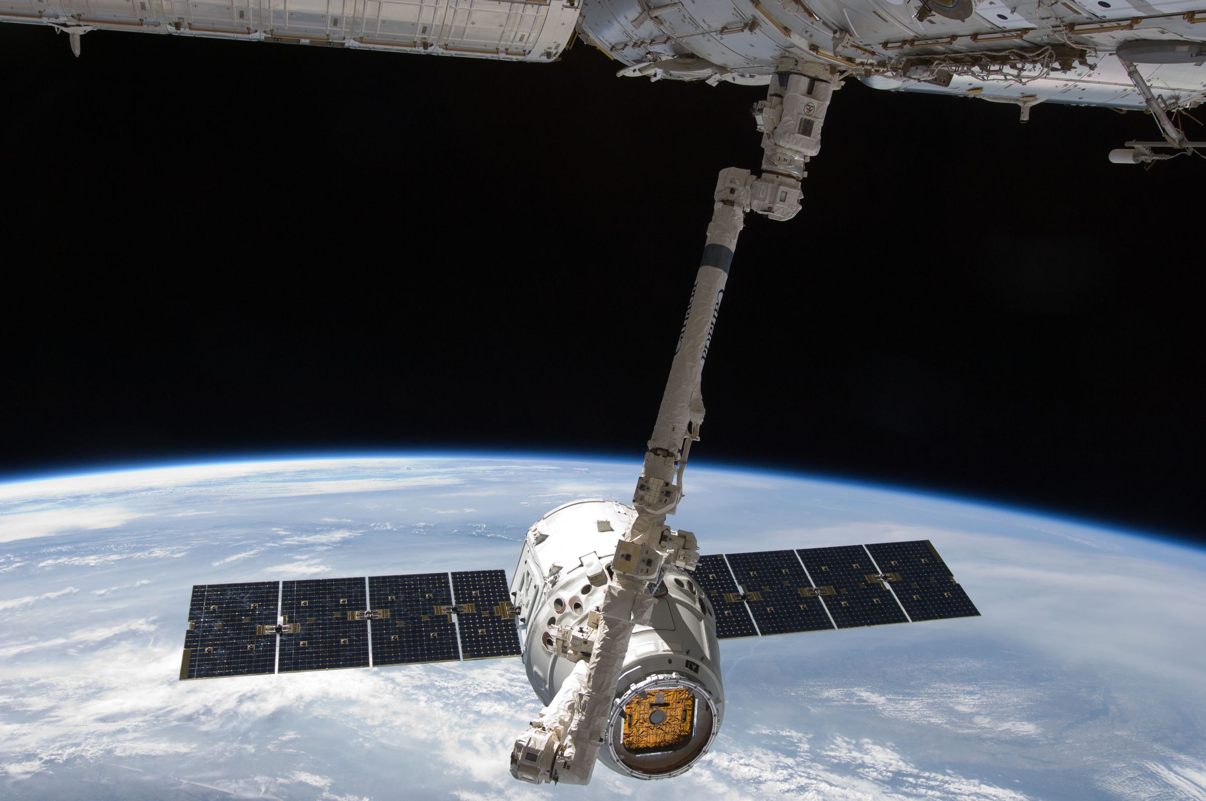 SpaceX’s Dragon, captured by the robotic arm on the International Space Station, in May 2012