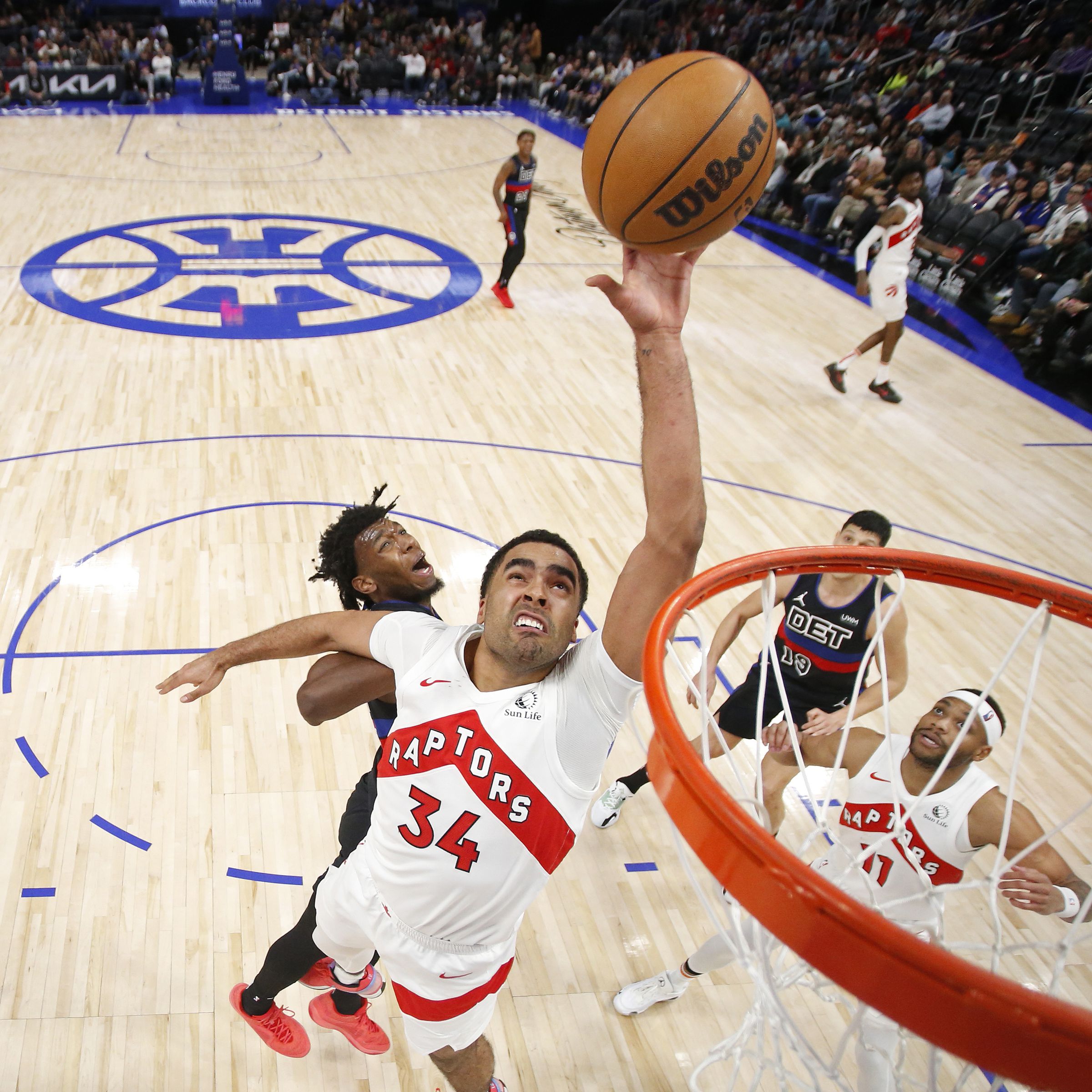 Jontay Porter #34 of the Toronto Raptors grabs a rebound during the game against the Detroit Pistons on March 13, 2024 at Little Caesars Arena in Detroit, Michigan.
