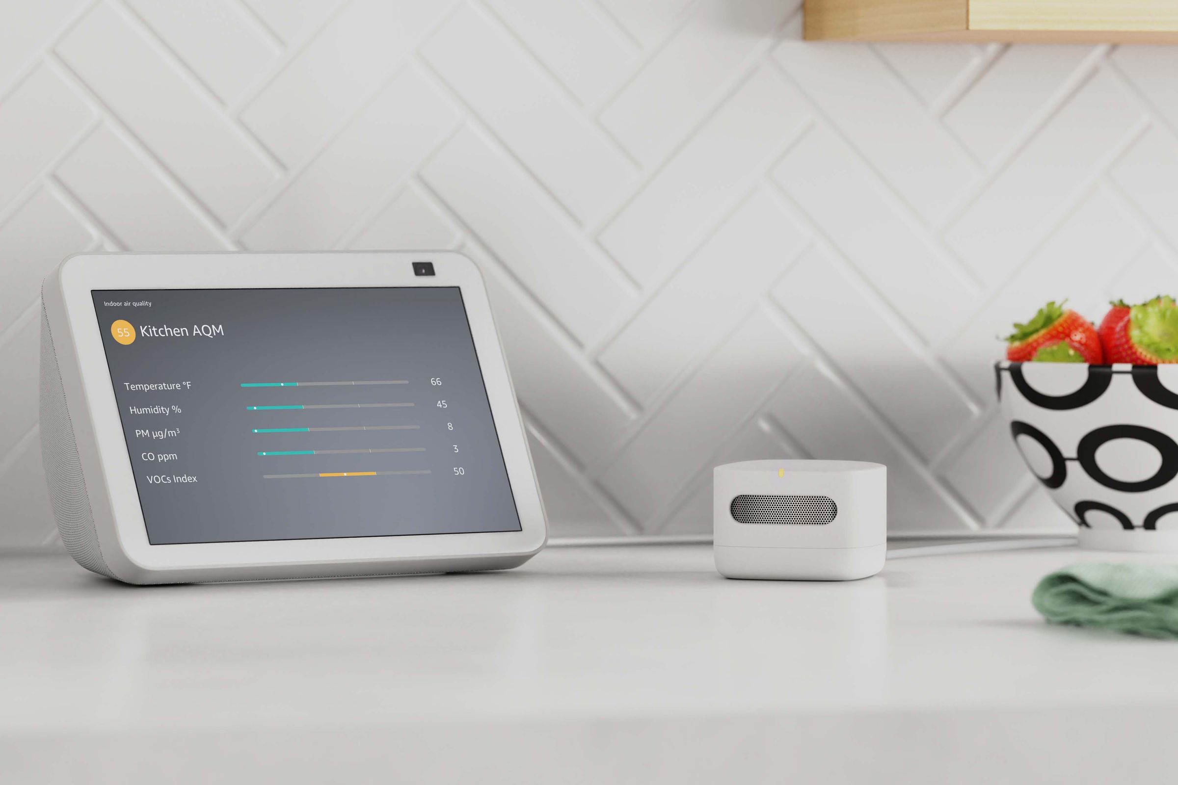 The air quality monitor (right) can show information on Echo Show devices. 