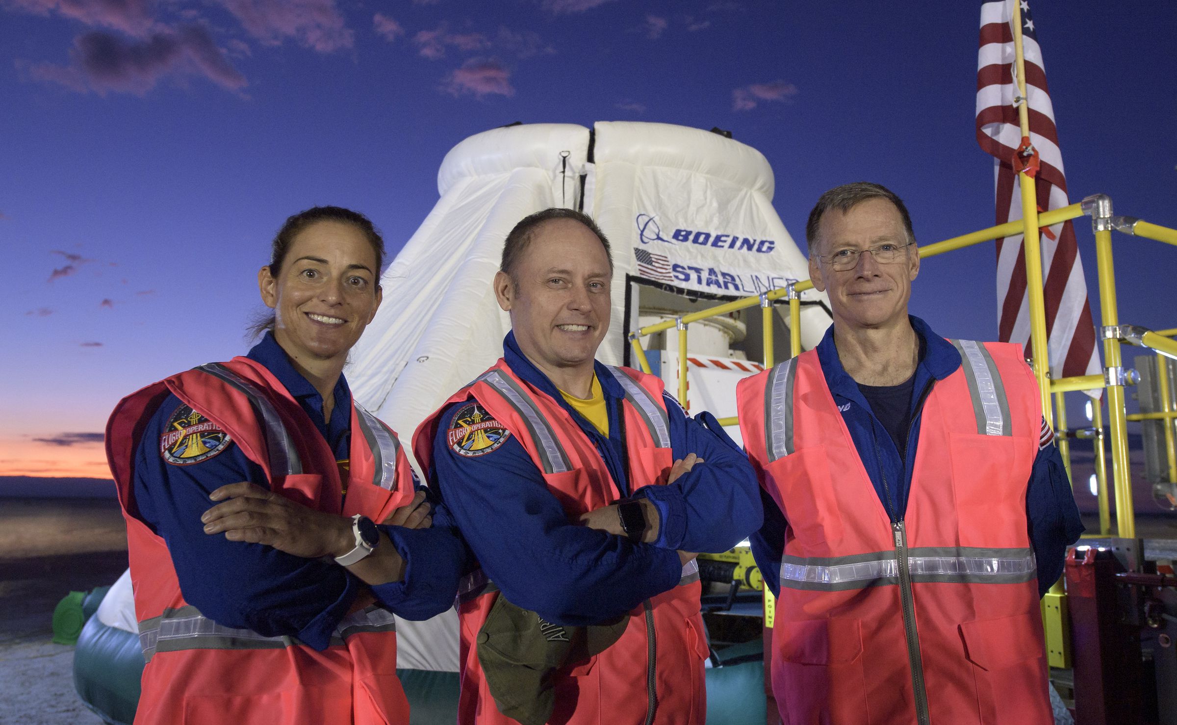 NASA astronauts Nicole Mann (L), Michael Fincke (C), and Boeing astronaut Christopher Ferguson (R).
