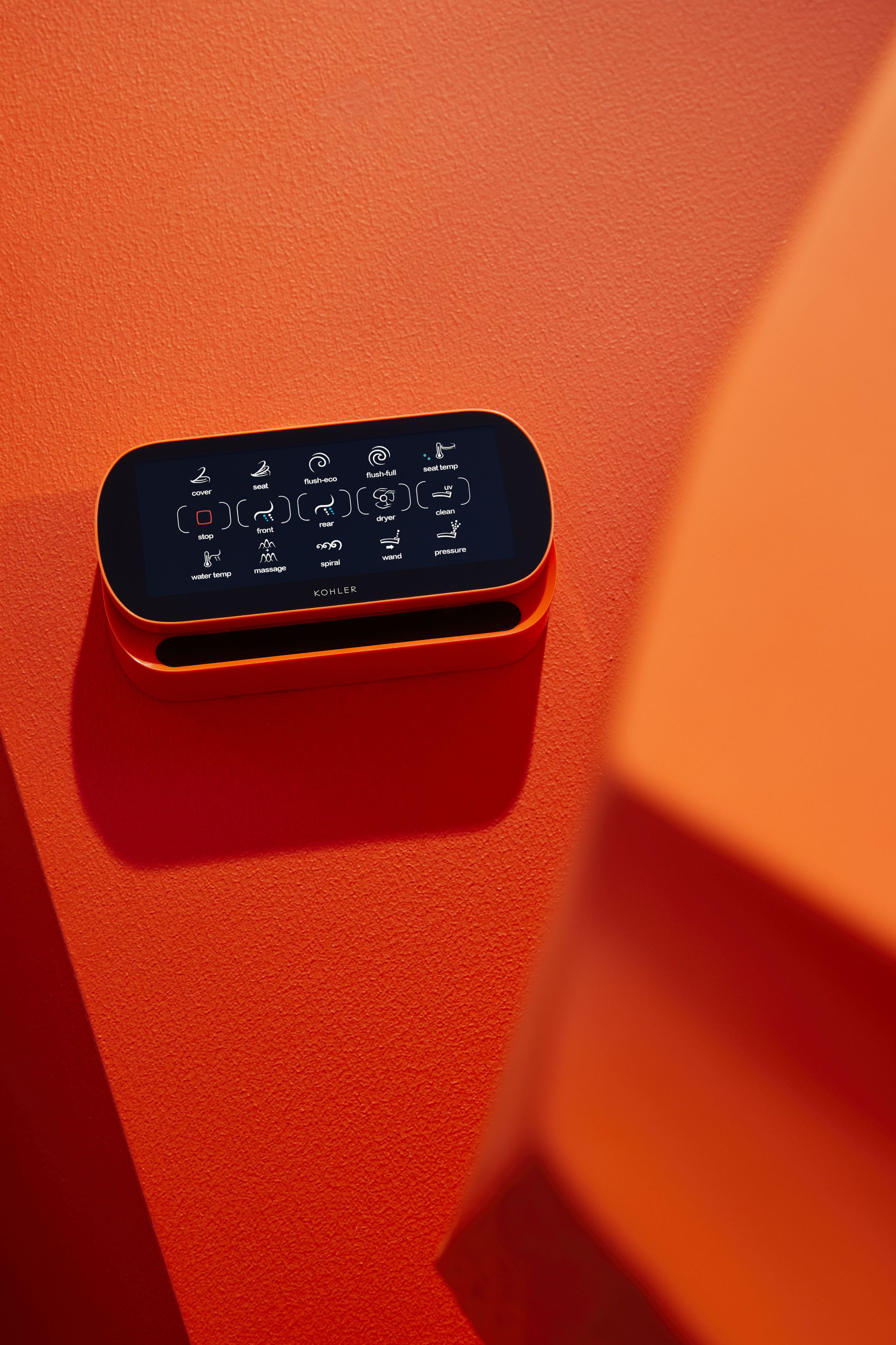 <em>There’s also a remote control, in orange.</em>