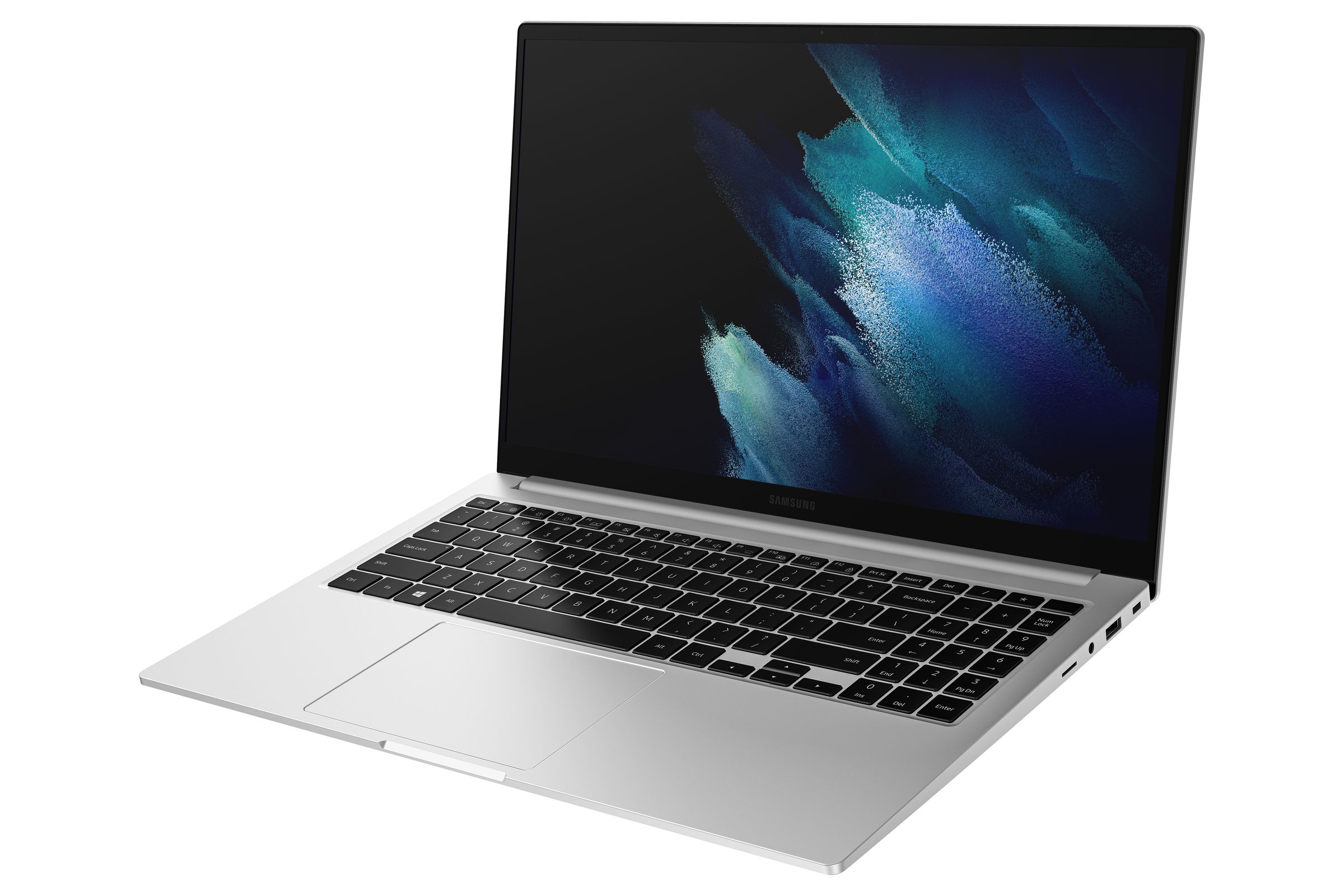 The Samsung Galaxy Book open, angled to the left, on a white background. The screen displays a blue and black pattern.