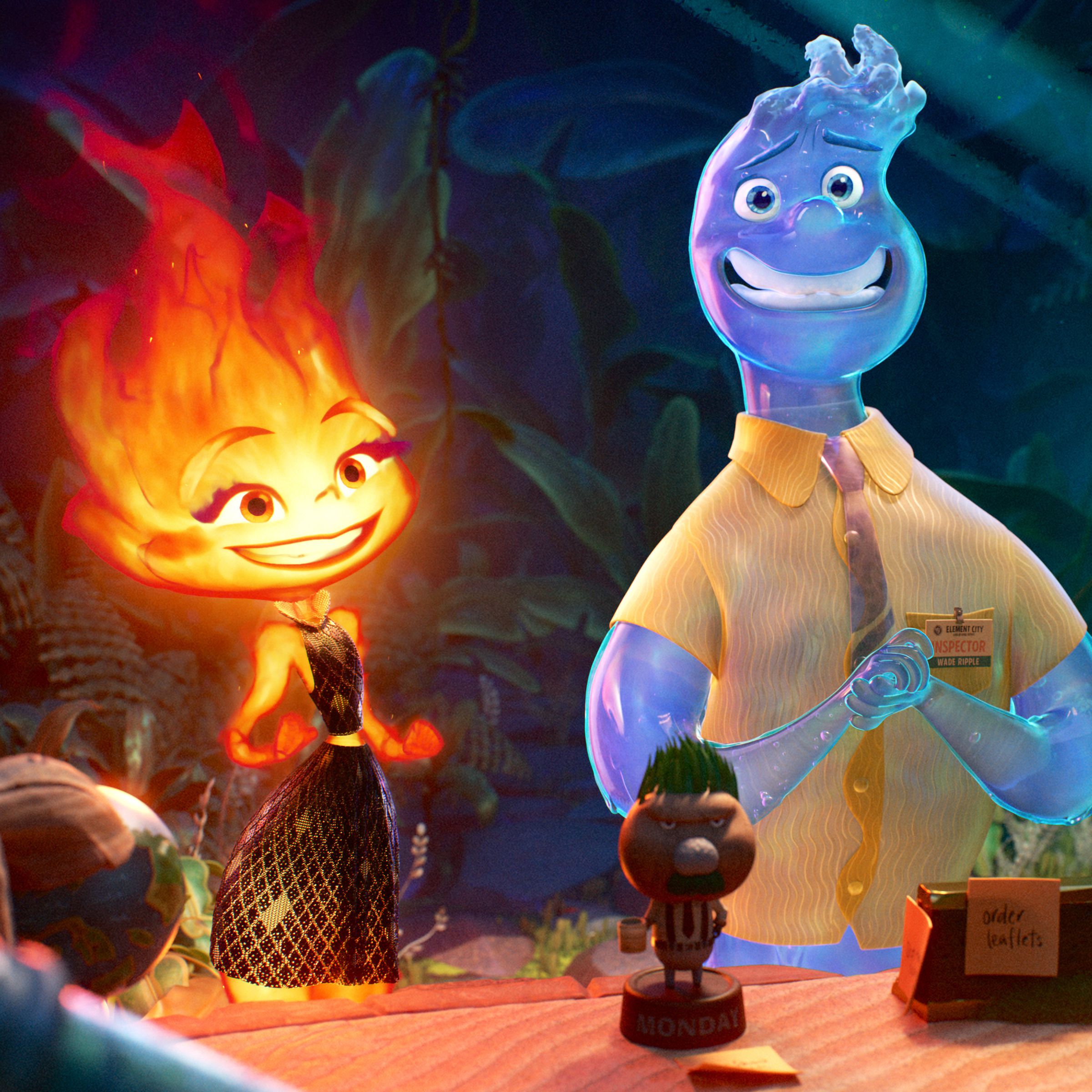 A humanoid wisp of flame in a metallic dress standing next to a humanoid made of water, dressed in a  button down shirt and tie. The pair are standing nervously in front of a desk.