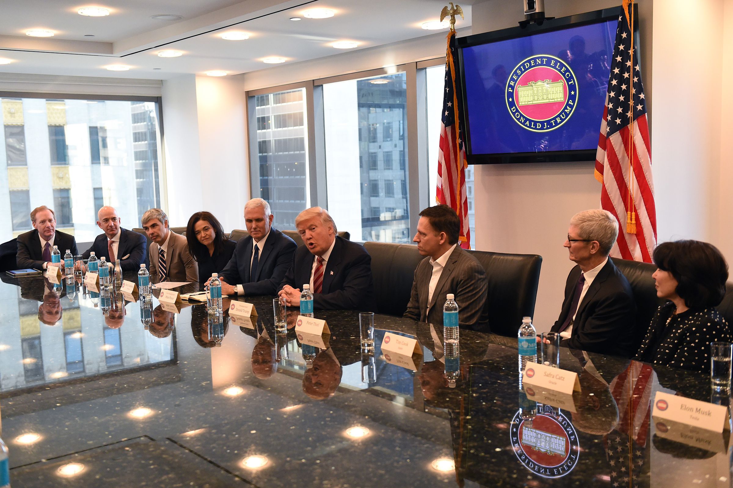 Amazon's chief Jeff Bezos, Larry Page of Alphabet, Facebook COO Sheryl Sandberg, Vice President elect Mike Pence, President-elect Donald Trump, Peter Thiel, co-founder and former CEO of PayPal, Tim Cook of Apple and Safra Catz of Oracle attend a meeting a
