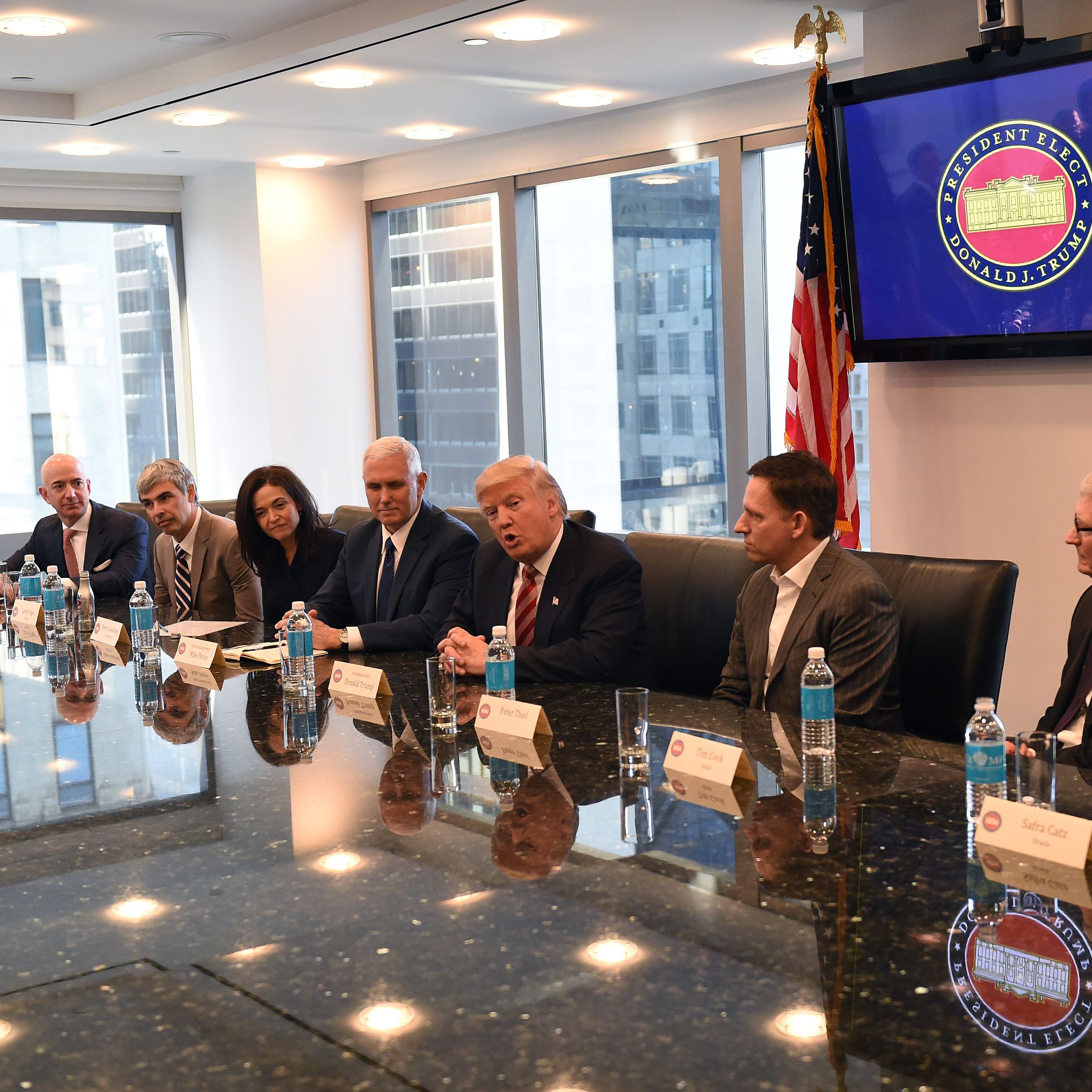 Amazon's chief Jeff Bezos, Larry Page of Alphabet, Facebook COO Sheryl Sandberg, Vice President elect Mike Pence, President-elect Donald Trump, Peter Thiel, co-founder and former CEO of PayPal, Tim Cook of Apple and Safra Catz of Oracle attend a meeting a