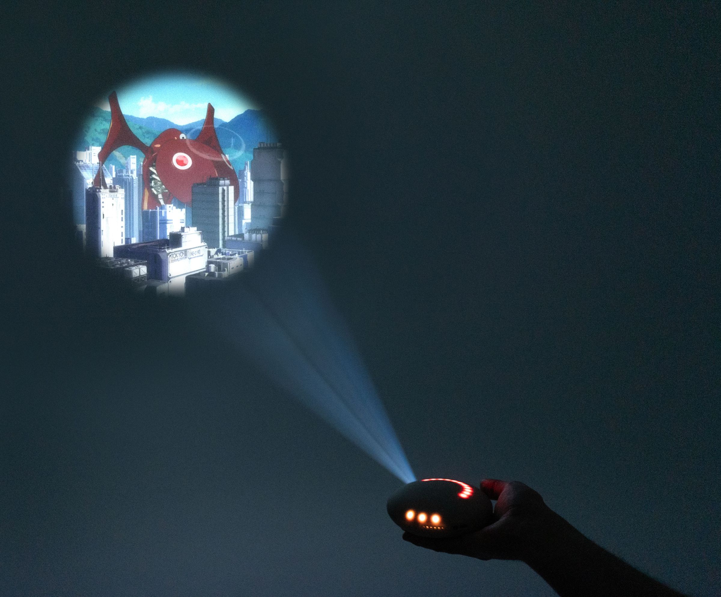 A photo of the Stem Projector beaming an image onto a wall.