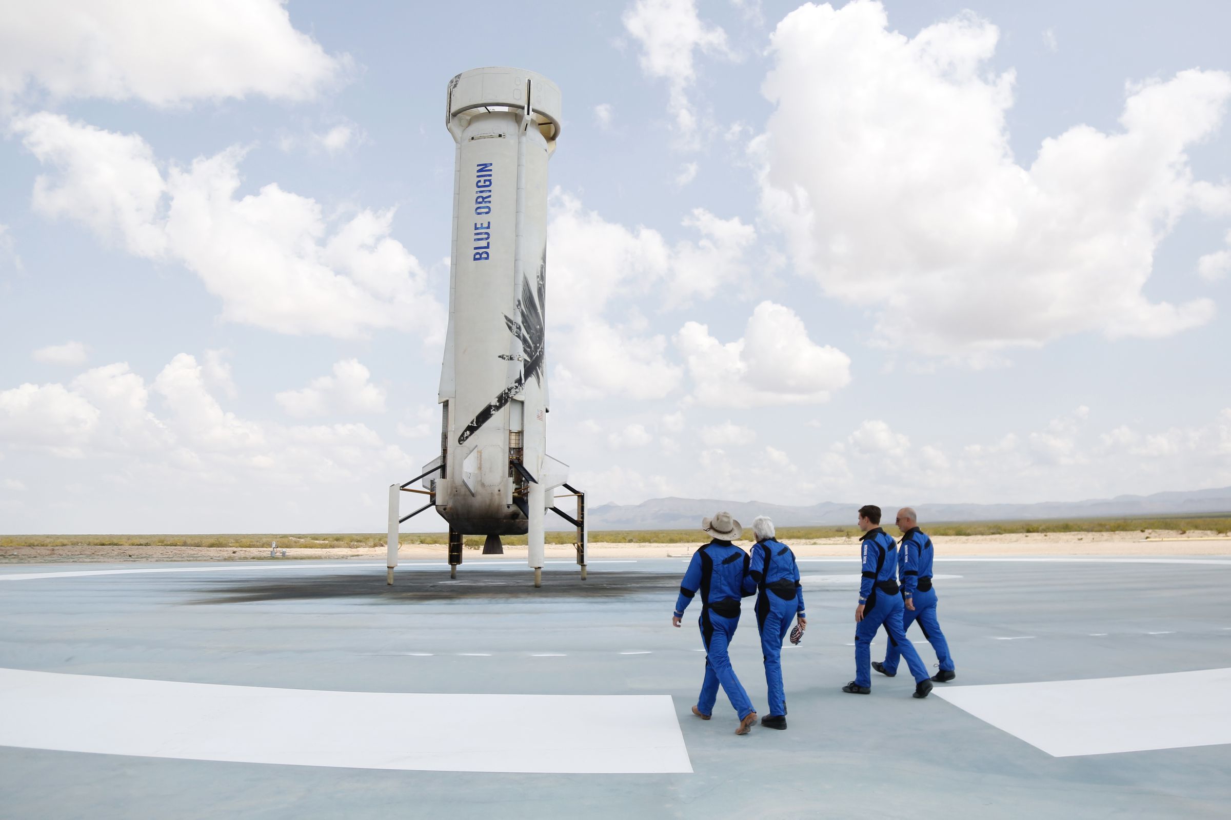 Blue Origin’s NS-16 crew walks on New Shepard’s landing pad hours after launching to and returning from the edge of space.