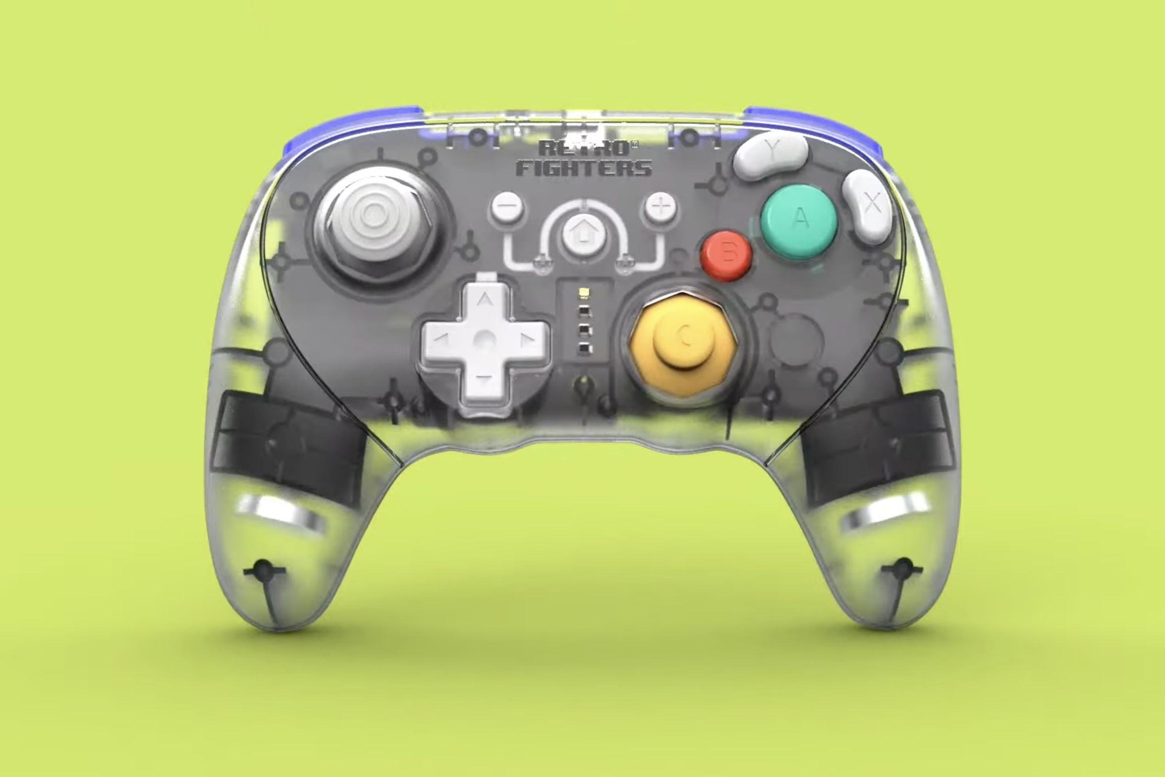 GameCube-style controller with a clear plastic shell, LEDs down the middle to show player number, Retro Fighters text logo, symmetrical triggers and a familiar yellow C stick nub.