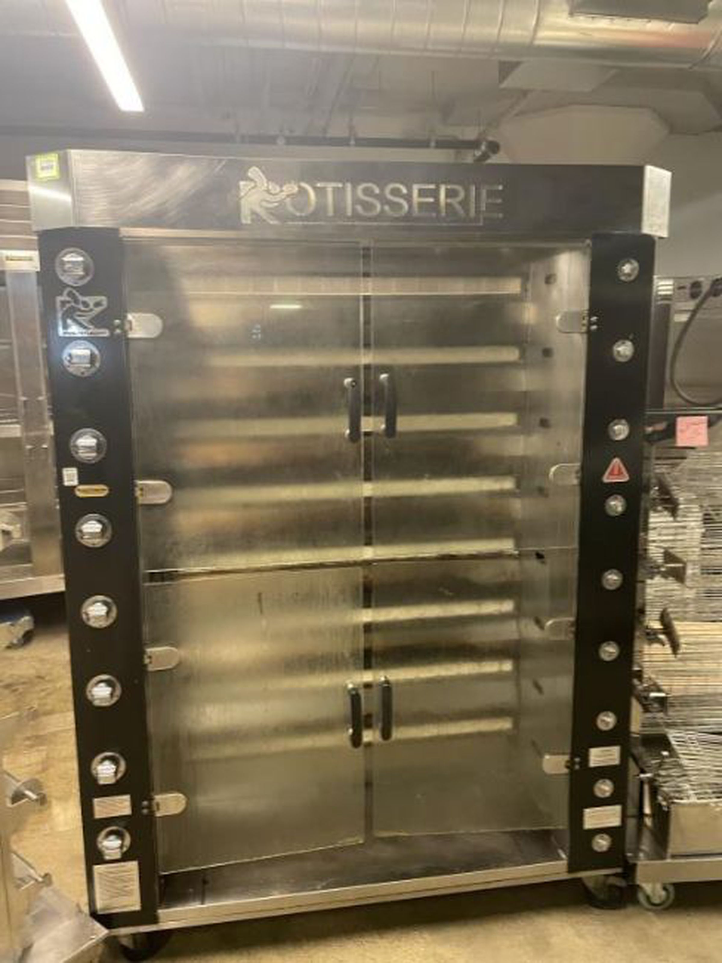 <em>Coffee machines, rotisserie ovens, and industrial griddles are also listed on the online auction.</em>