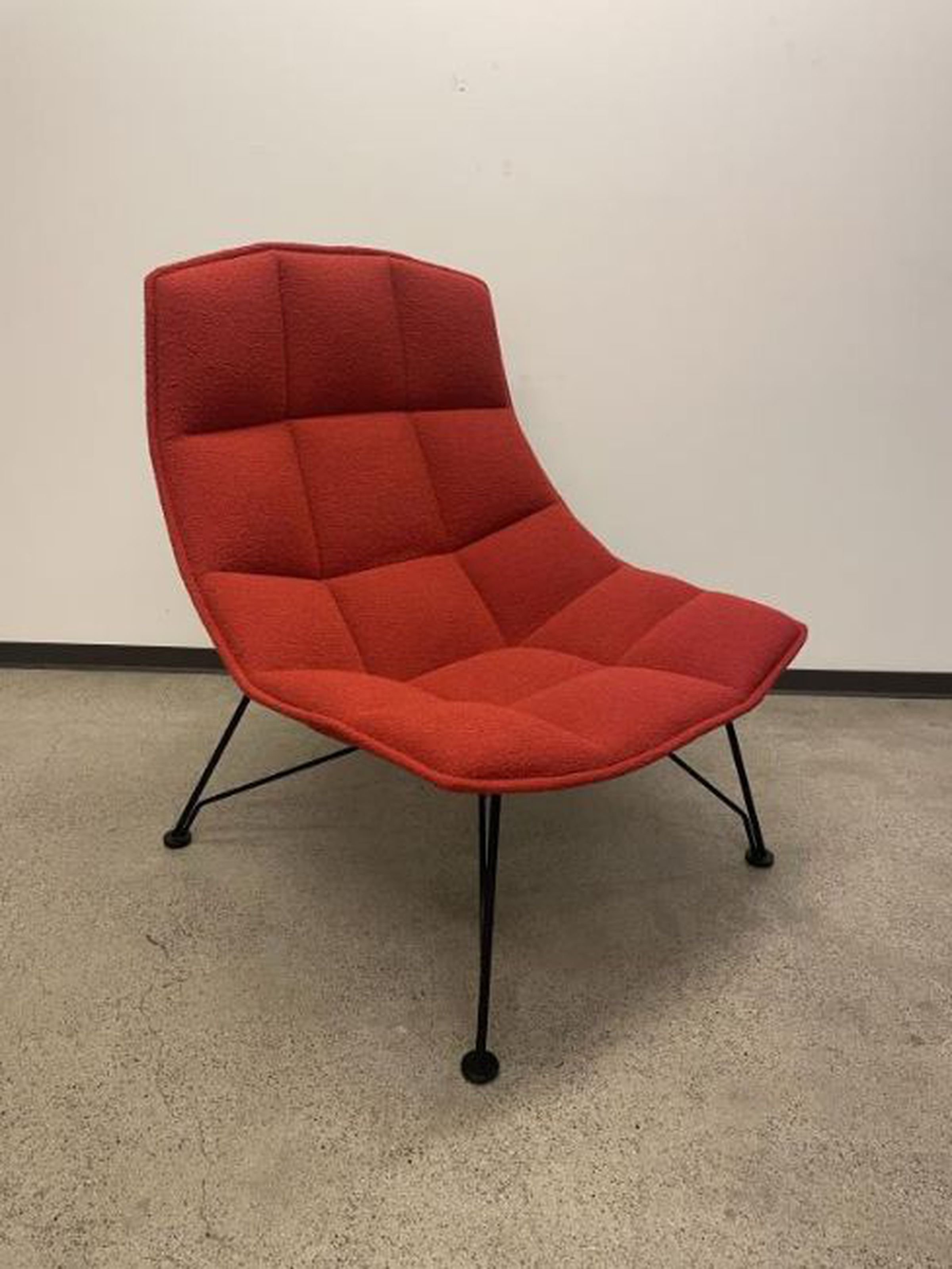 A red Knoll Studio 2009 Jehs+Laub lounge chair