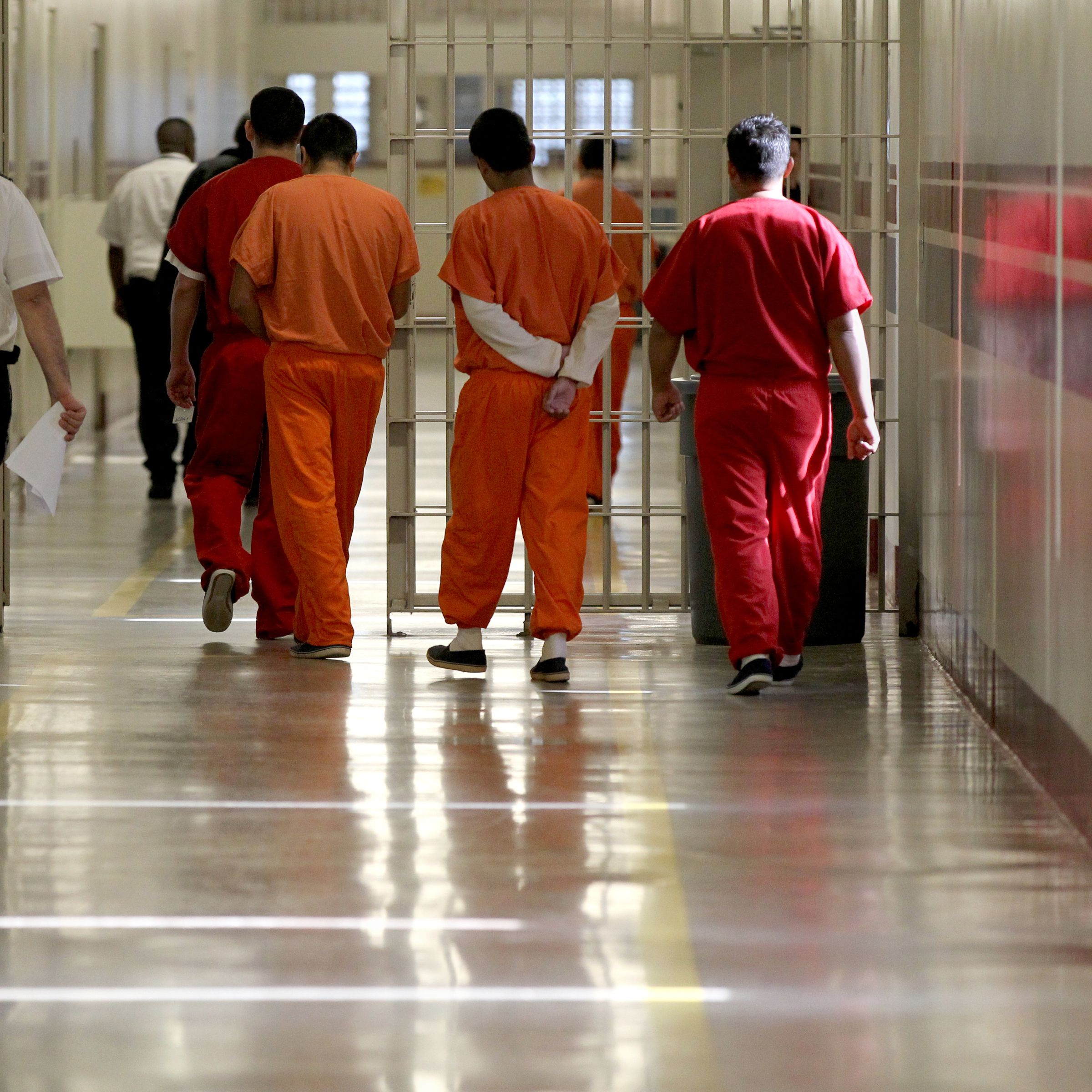 LUMPKIN, GA - MAY 4: Detainees at the Stewart Detention Center in Lumpkin, Ga. are escorted through a corridor. 