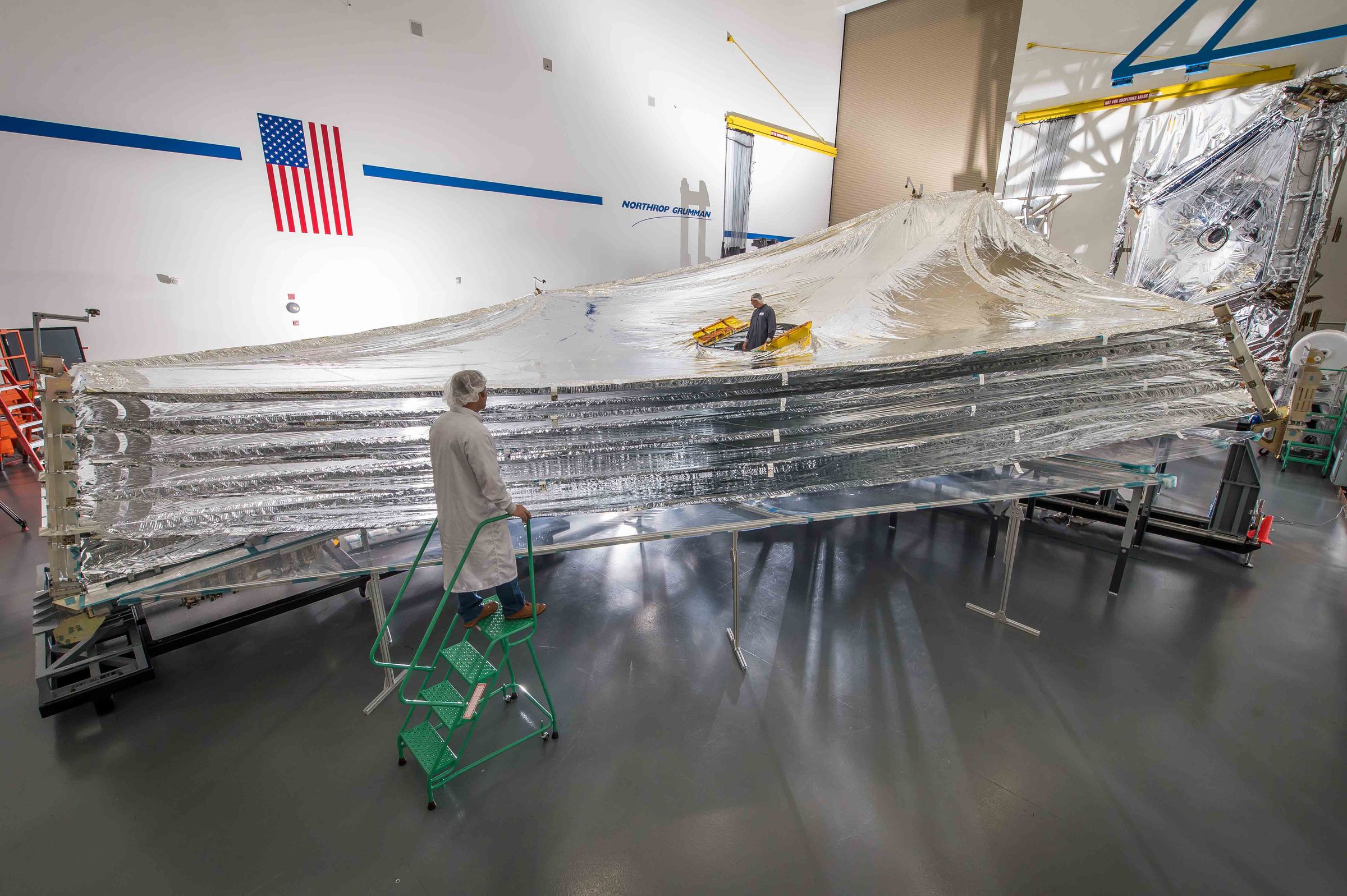 The layers of JWST’s sunshield extended and pulled taut.
