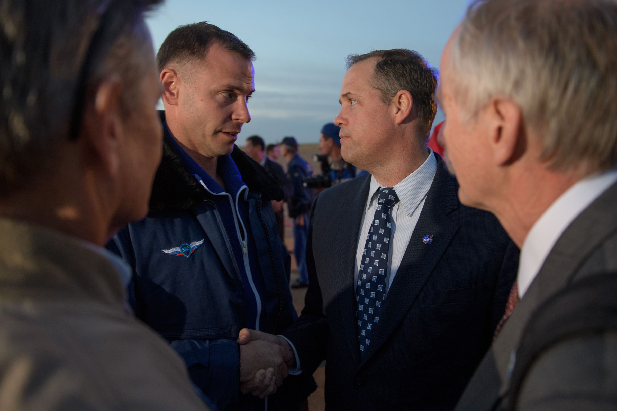 NASA astronaut Nick Hague (L) shakes hands with NASA administrator Jim Bridenstine after landing back on Earth